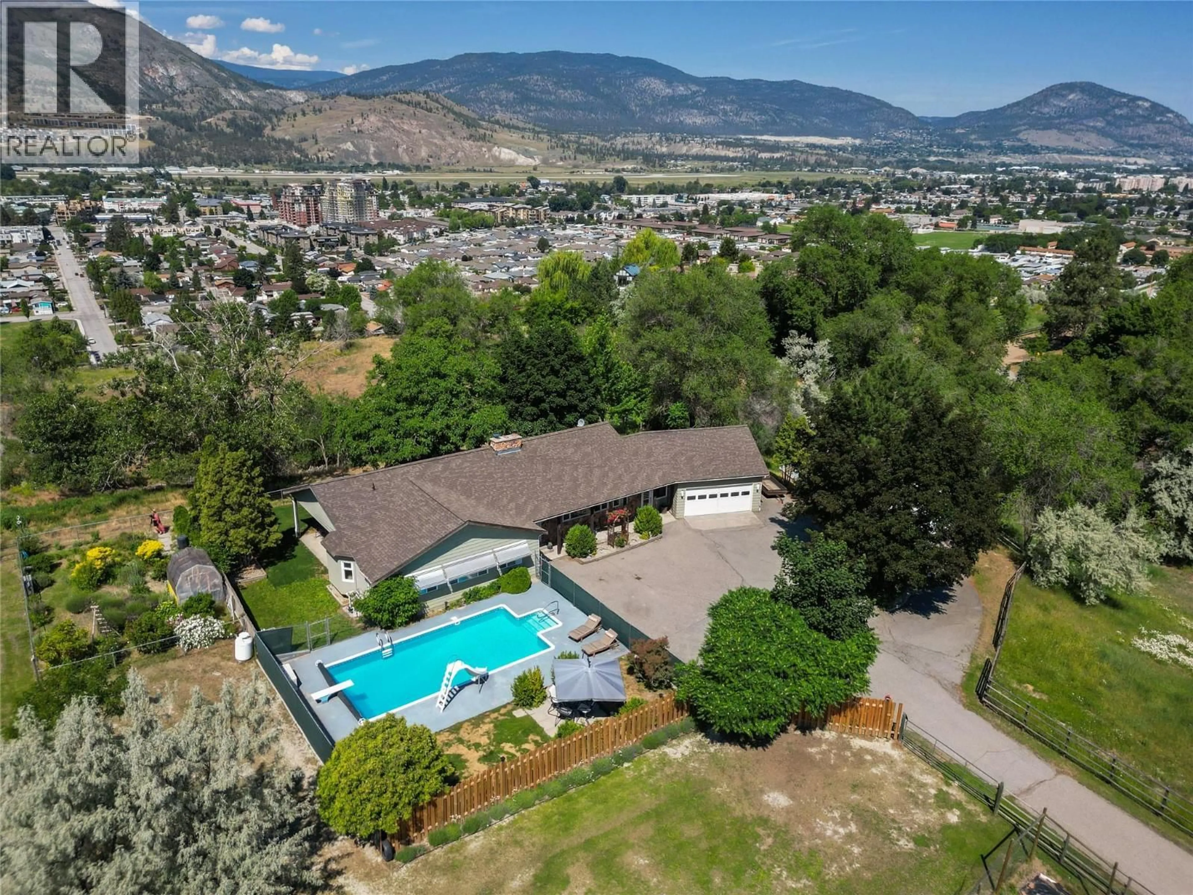 A pic from outside/outdoor area/front of a property/back of a property/a pic from drone, mountain view for 3575 VALLEYVIEW ROAD, Penticton British Columbia V2A8W9