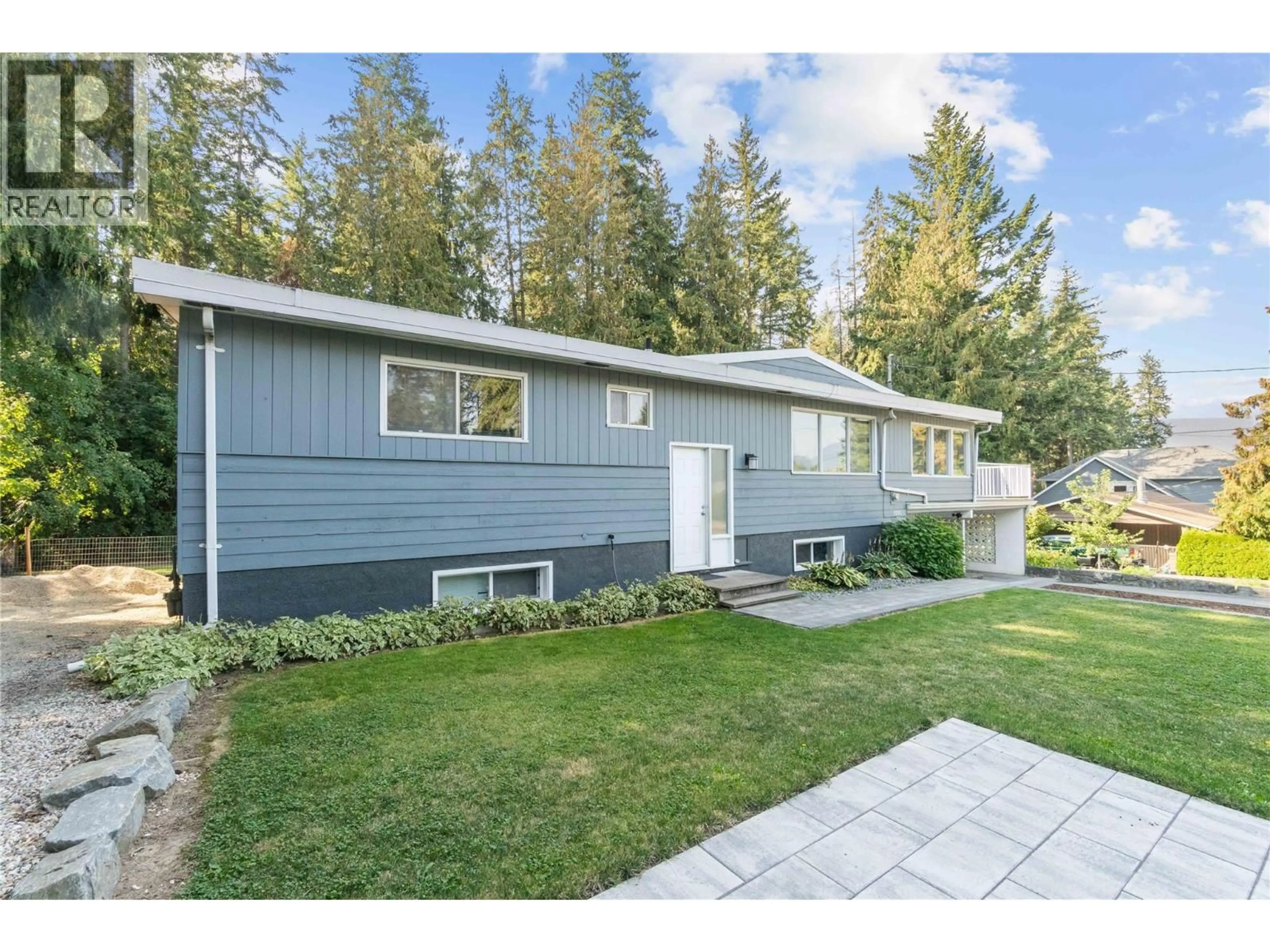 Home with vinyl exterior material, street for 3280 28 AVENUE NORTHEAST, Salmon Arm British Columbia V1E3G1