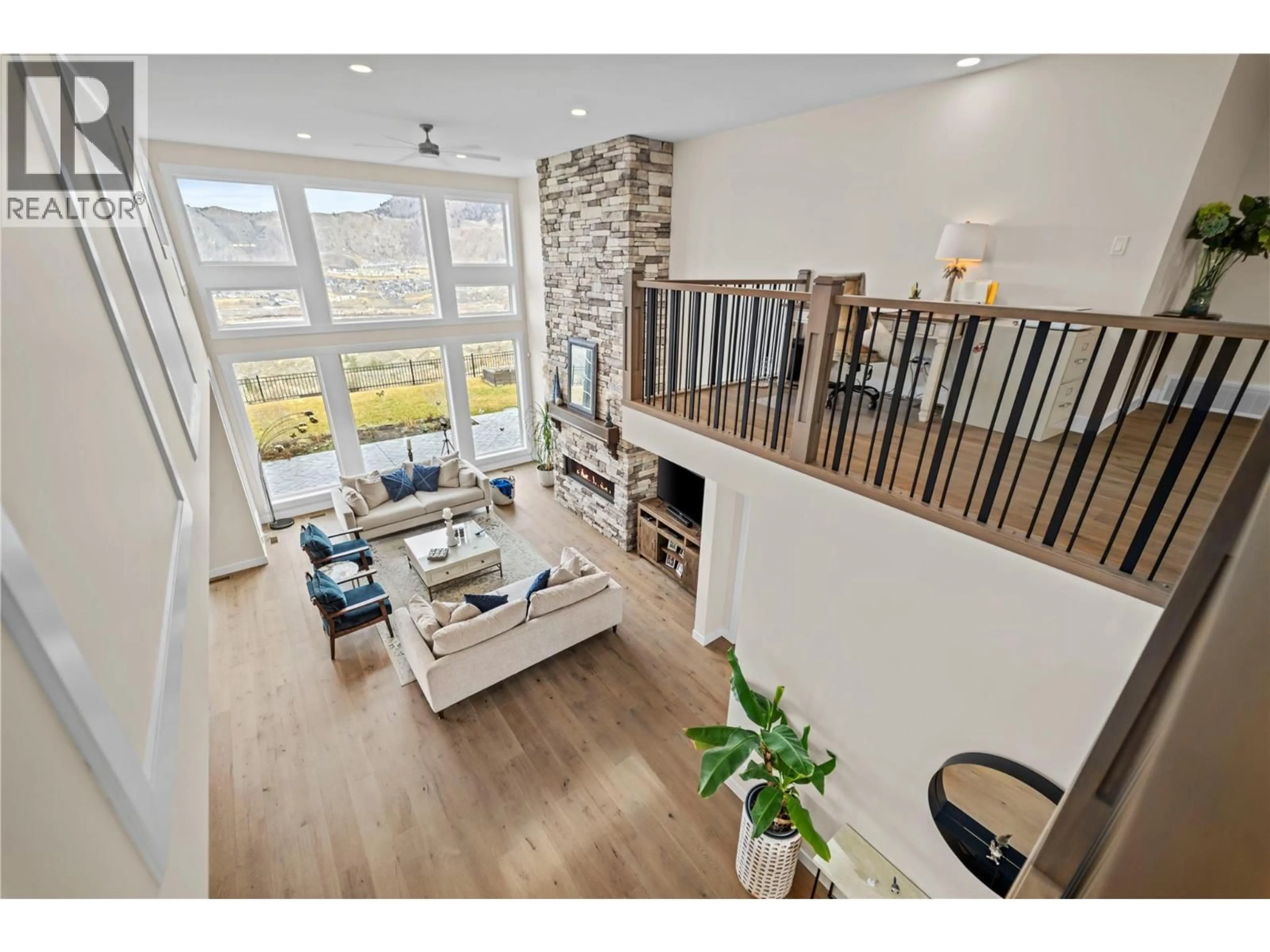 Living room with furniture, wood/laminate floor for 1330 MYRA PLACE, Kamloops British Columbia V2E0C3