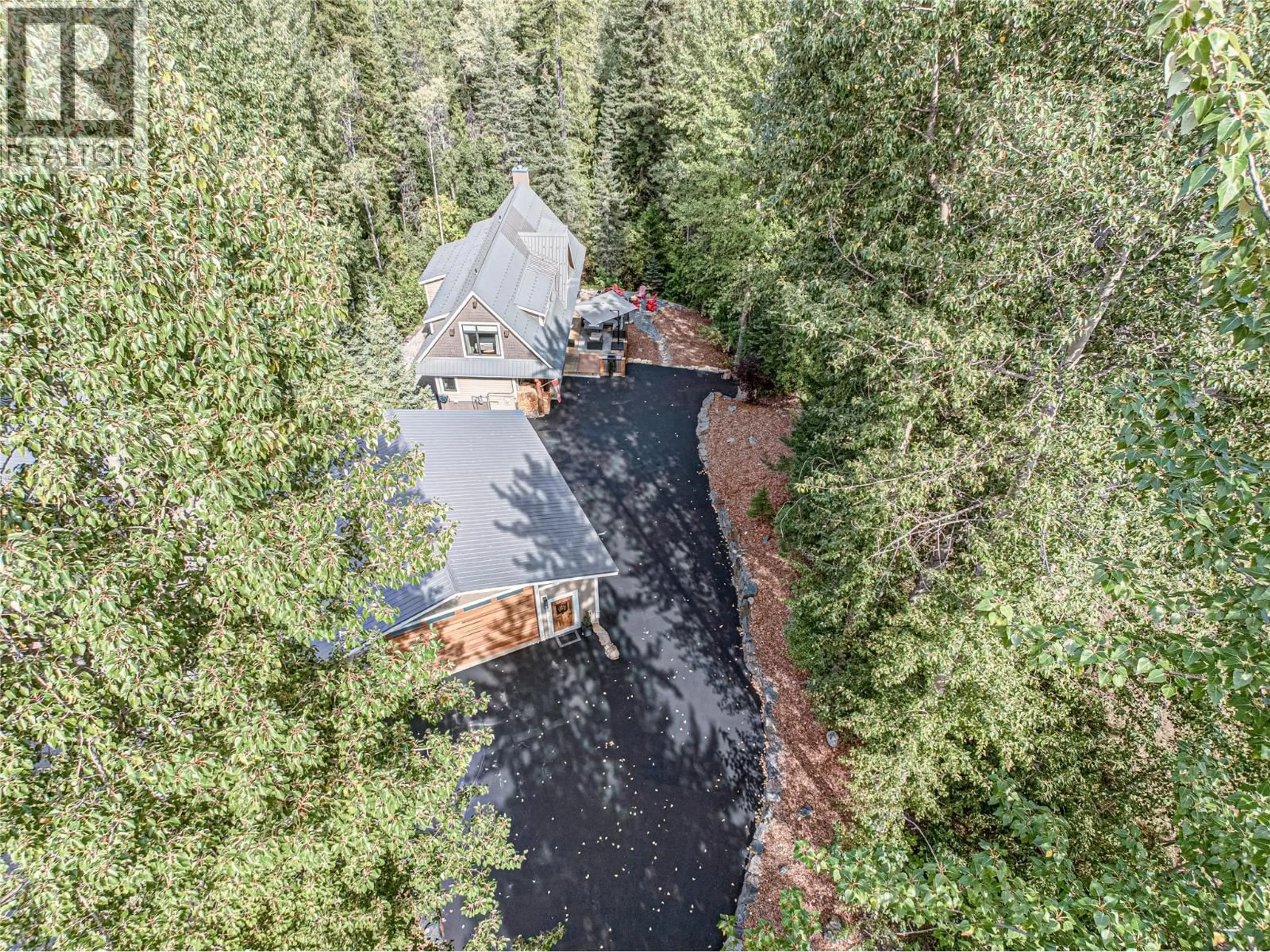 A pic from outside/outdoor area/front of a property/back of a property/a pic from drone, forest/trees view for 350 CANYON TRAIL OTHER, Fernie British Columbia V0B1M6