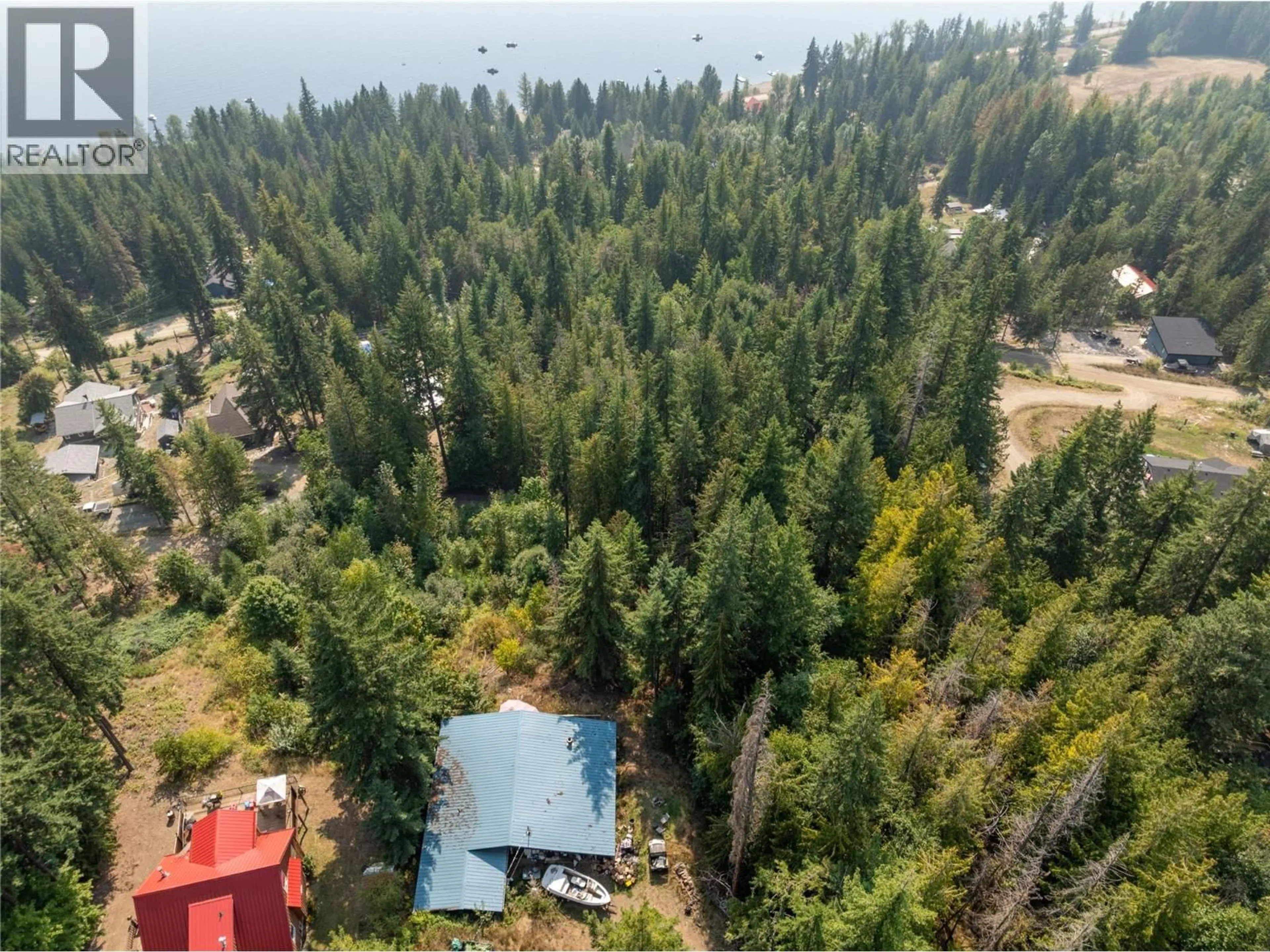 A pic from outside/outdoor area/front of a property/back of a property/a pic from drone, forest/trees view for 7578 STAMPEDE TRAIL, Anglemont British Columbia V0E1M8
