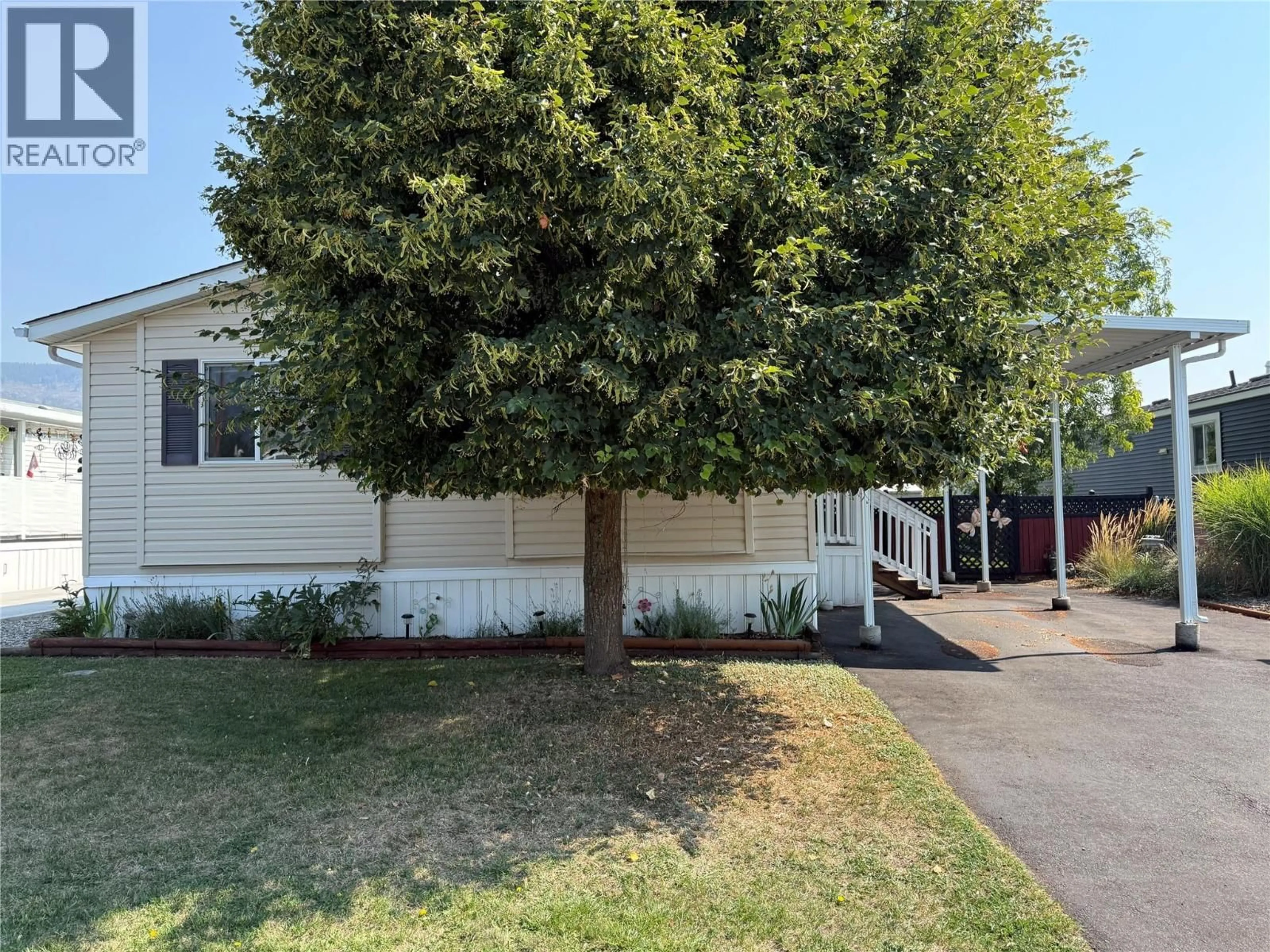 A pic from outside/outdoor area/front of a property/back of a property/a pic from drone, street for 34 - 7225 BOUNDARY DRIVE, Grand Forks British Columbia V0H1H0