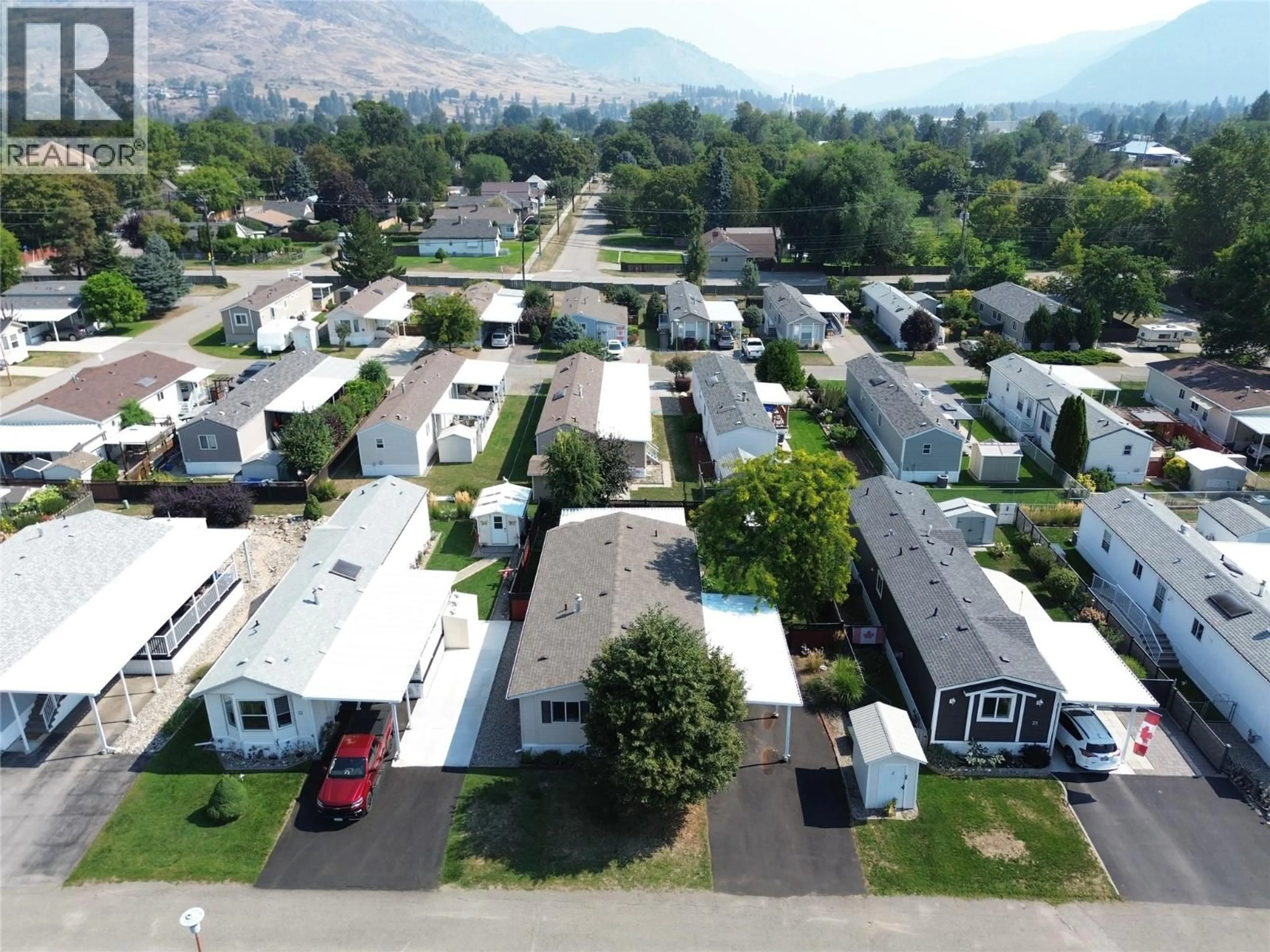 A pic from outside/outdoor area/front of a property/back of a property/a pic from drone, mountain view for 34 - 7225 BOUNDARY DRIVE, Grand Forks British Columbia V0H1H0