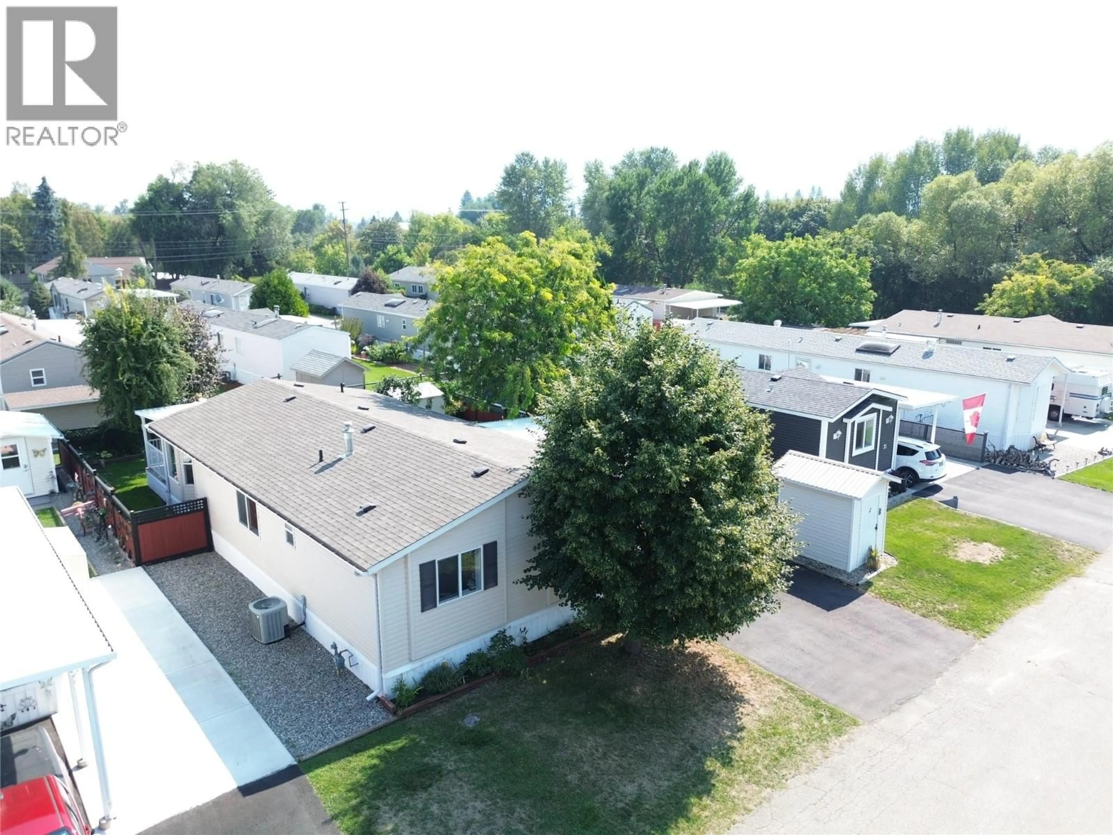 A pic from outside/outdoor area/front of a property/back of a property/a pic from drone, street for 34 - 7225 BOUNDARY DRIVE, Grand Forks British Columbia V0H1H0