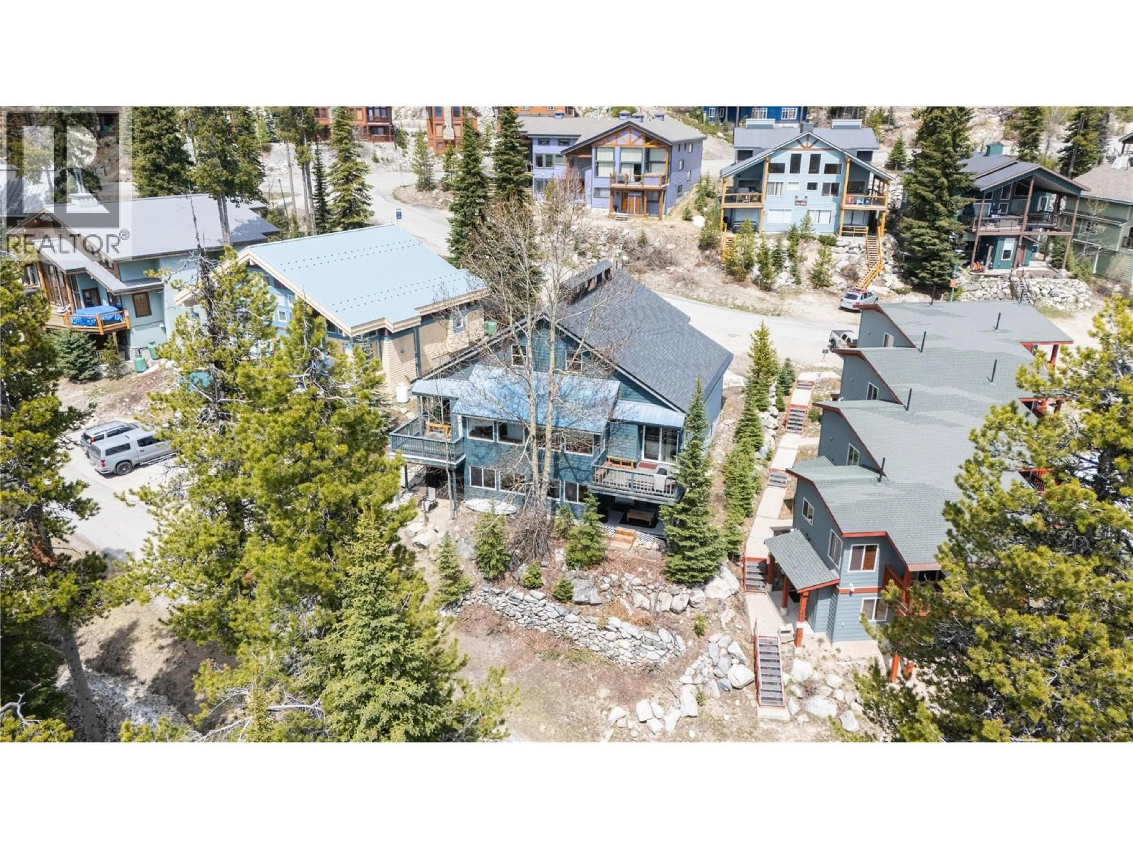 A pic from outside/outdoor area/front of a property/back of a property/a pic from drone, mountain view for C - 4817 SNOWPINES ROAD, Big White British Columbia V1V1P3