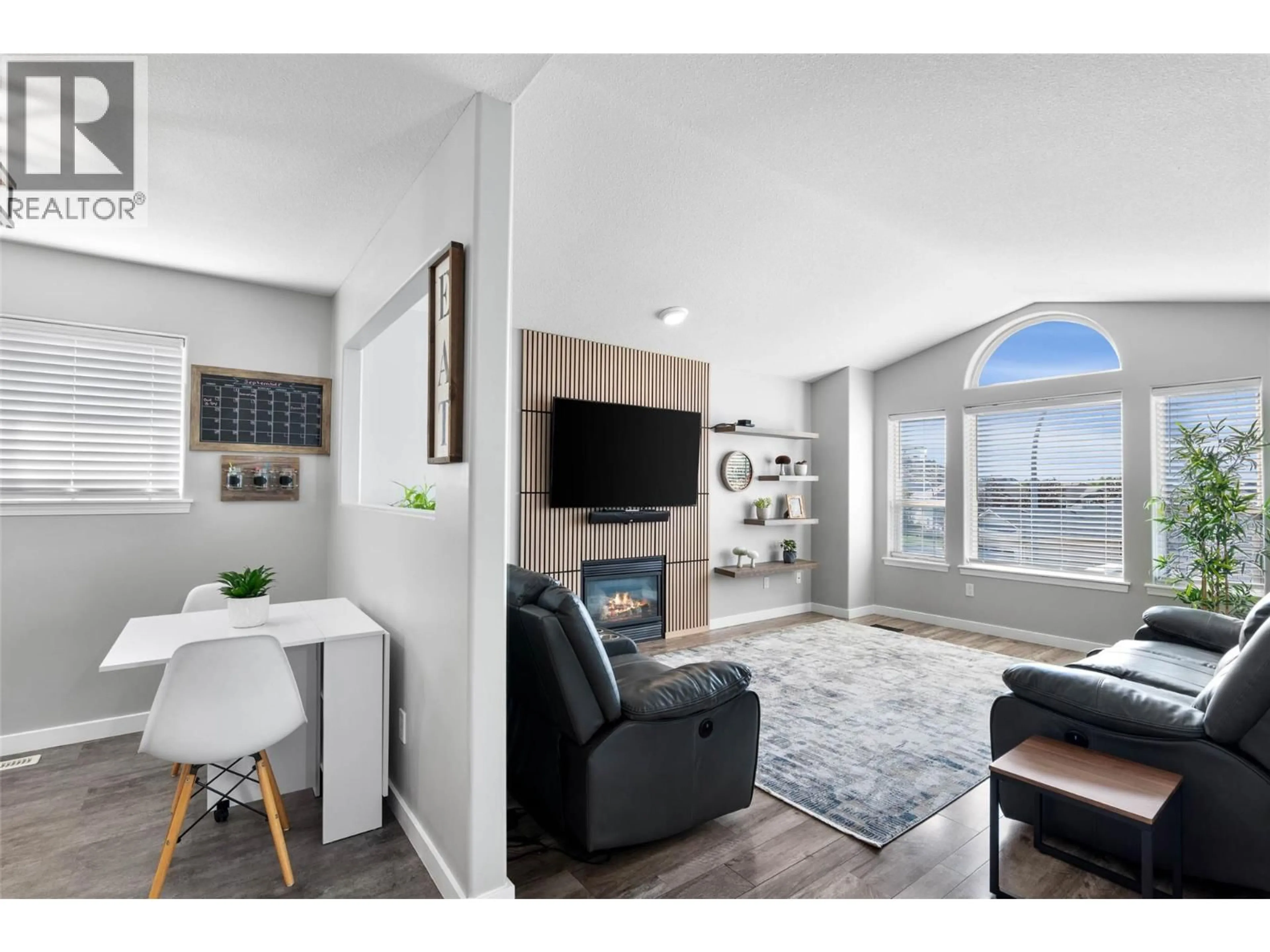 Living room with furniture, wood/laminate floor for 1126 RAVEN DRIVE, Kamloops British Columbia V2B8P3