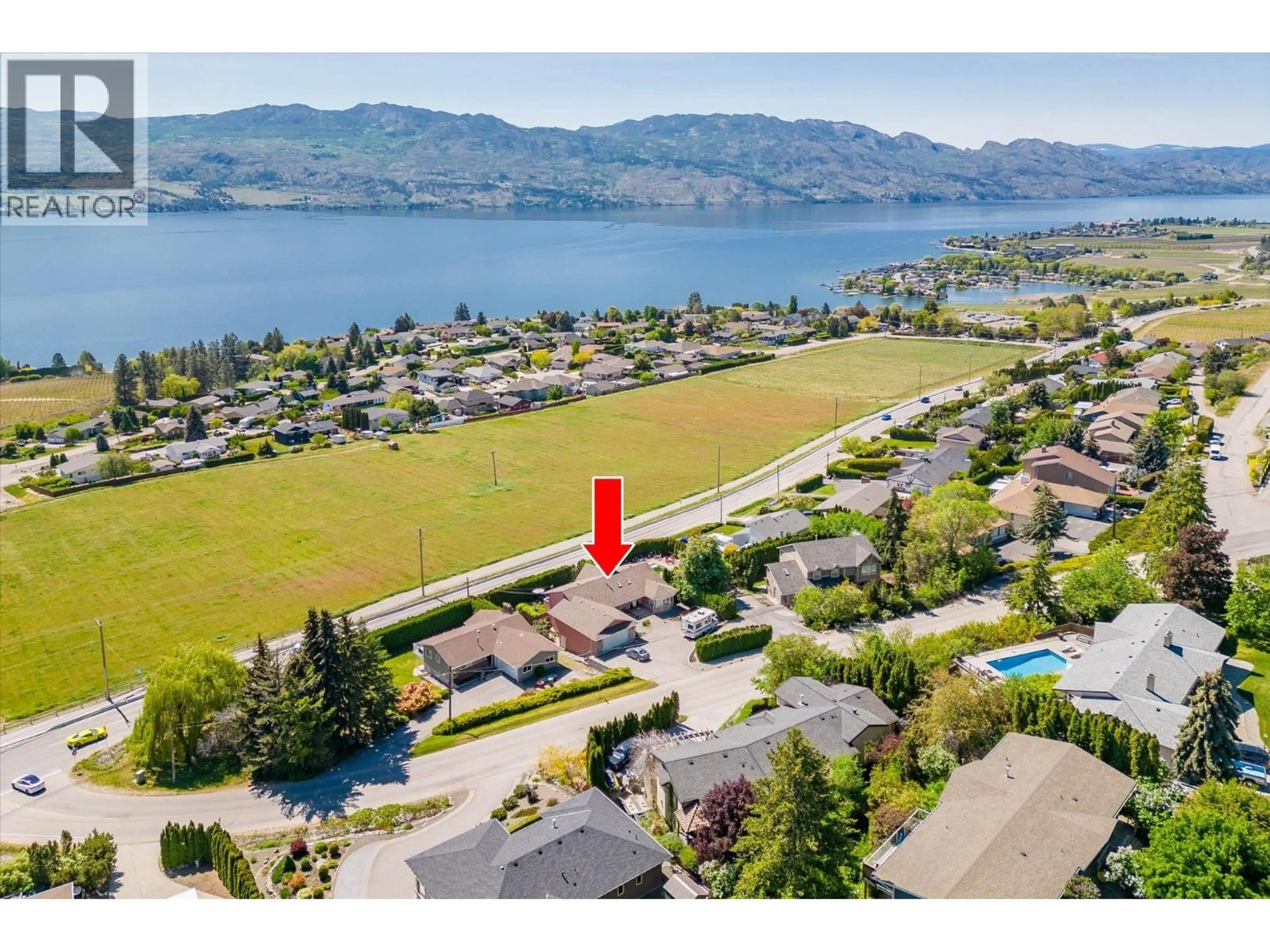 A pic from outside/outdoor area/front of a property/back of a property/a pic from drone, water/lake/river/ocean view for 1115 GREGORY ROAD, West Kelowna British Columbia V1Z2Y9