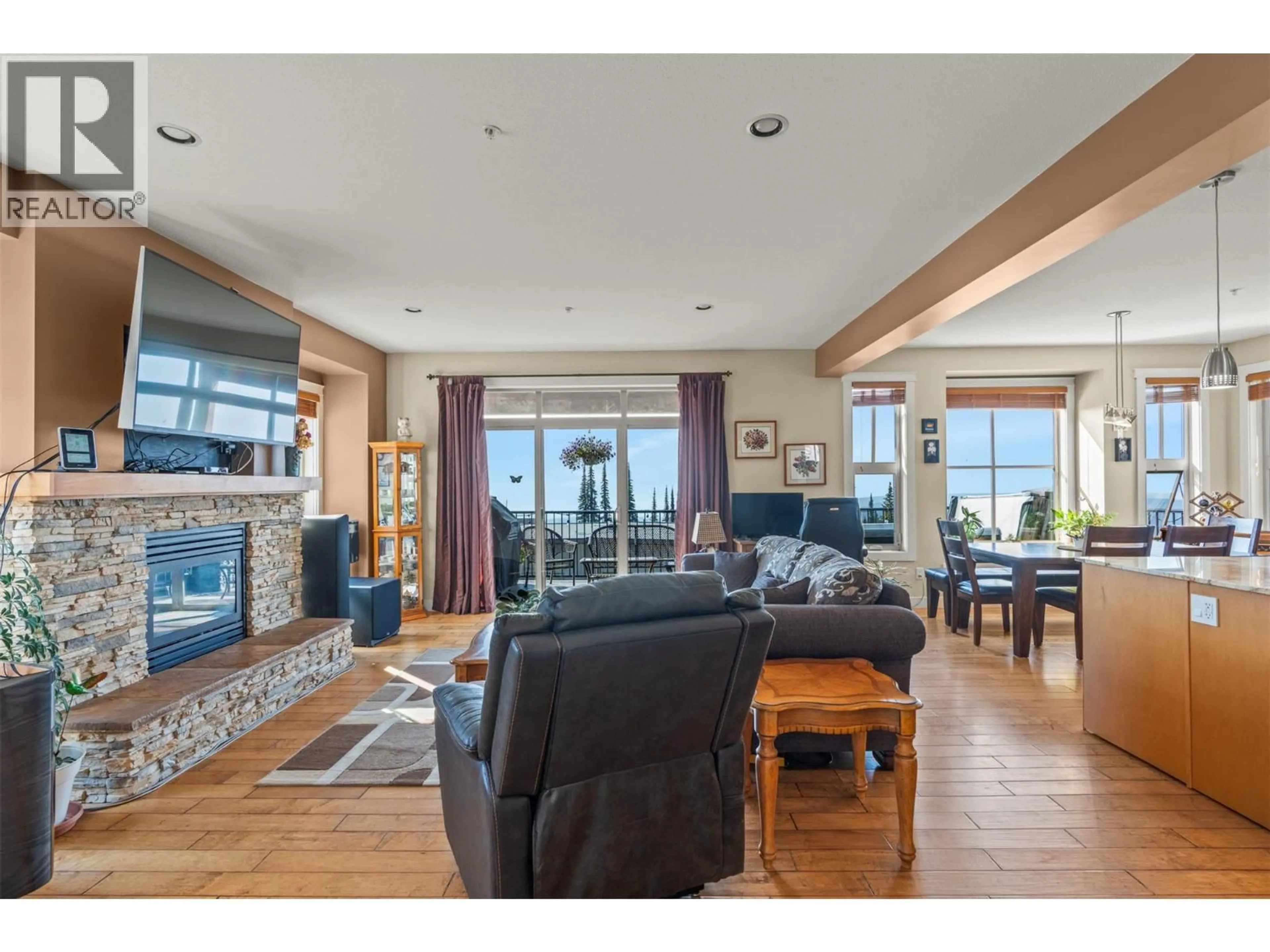 Living room with furniture, wood/laminate floor for 9950 PURCELL DRIVE, Vernon British Columbia V1B0S1