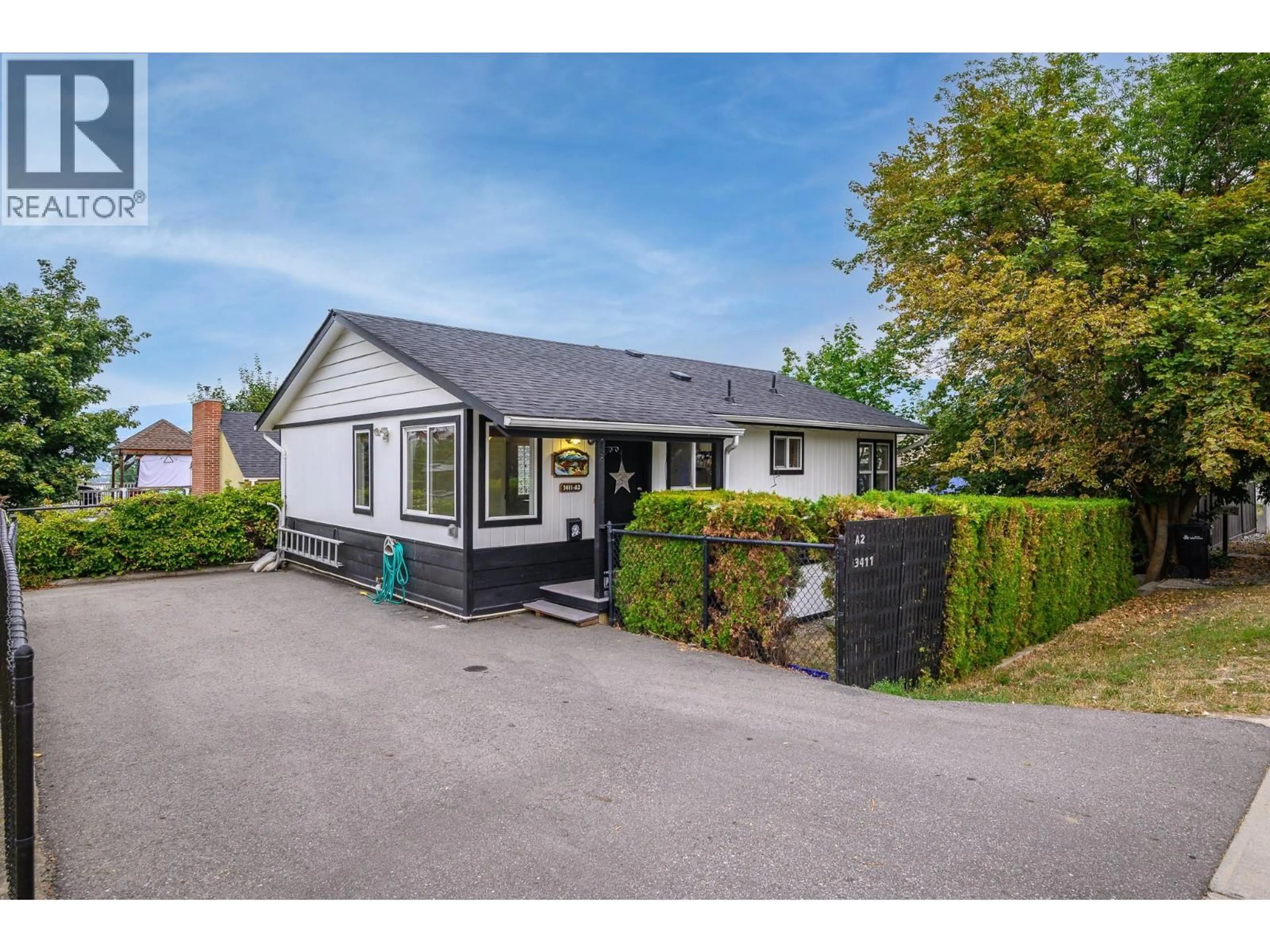 A pic from outside/outdoor area/front of a property/back of a property/a pic from drone, street for A2 - 3411 17 AVENUE, Vernon British Columbia V1T1B6