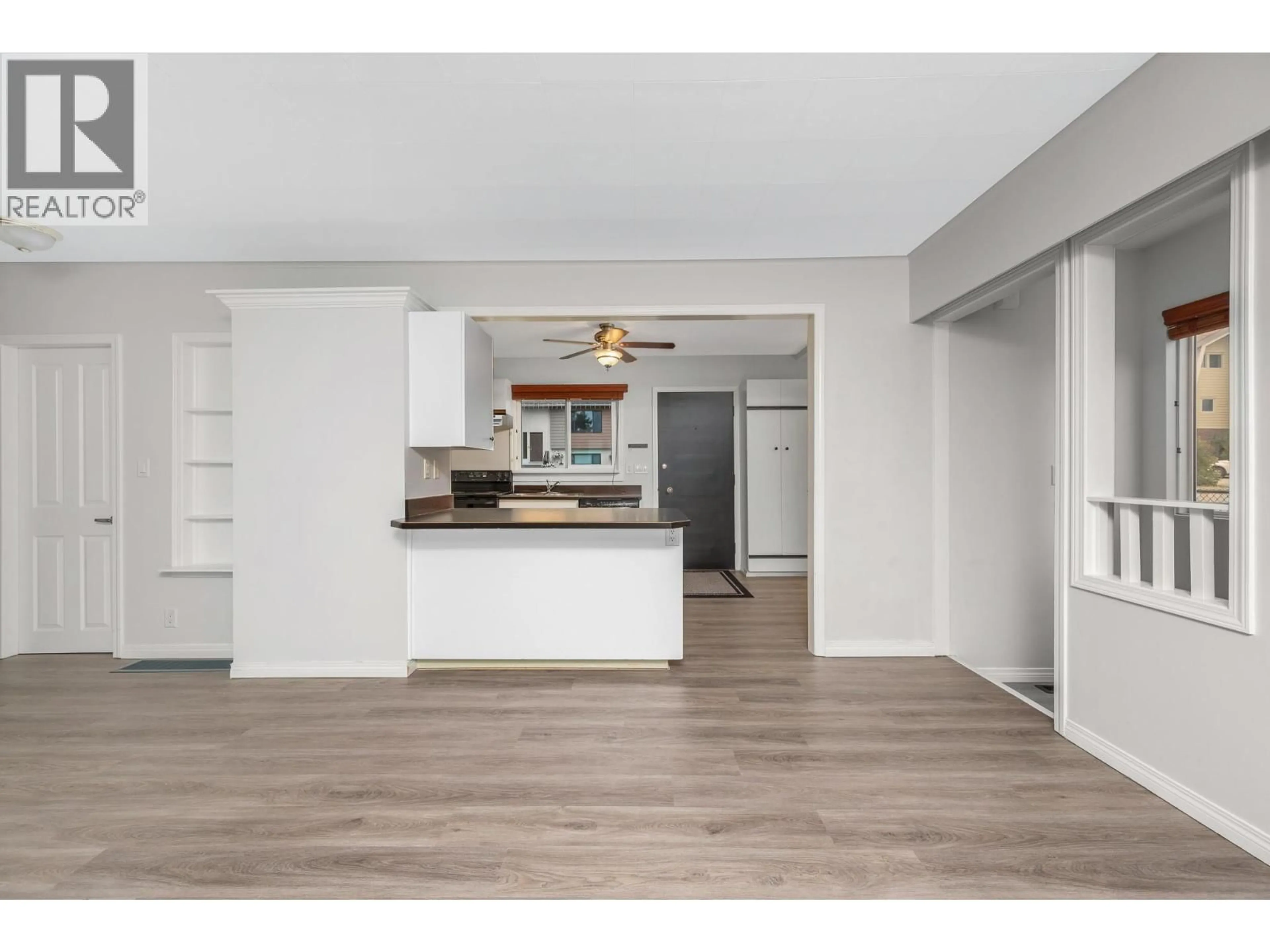 Open concept kitchen, wood/laminate floor for A2 - 3411 17 AVENUE, Vernon British Columbia V1T1B6