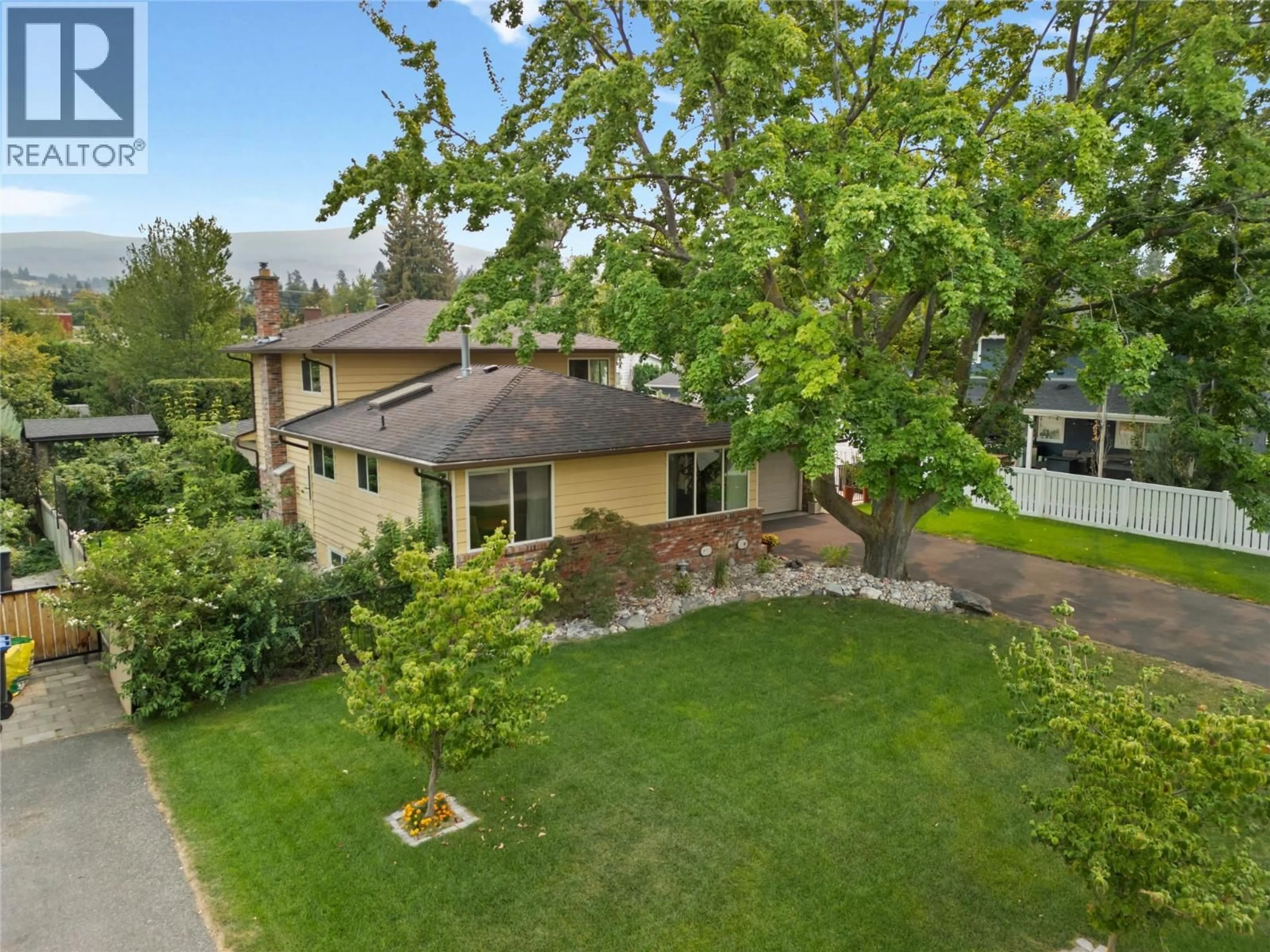 A pic from outside/outdoor area/front of a property/back of a property/a pic from drone, street for 4495 SWAISLAND ROAD, Kelowna British Columbia V1W1Y8