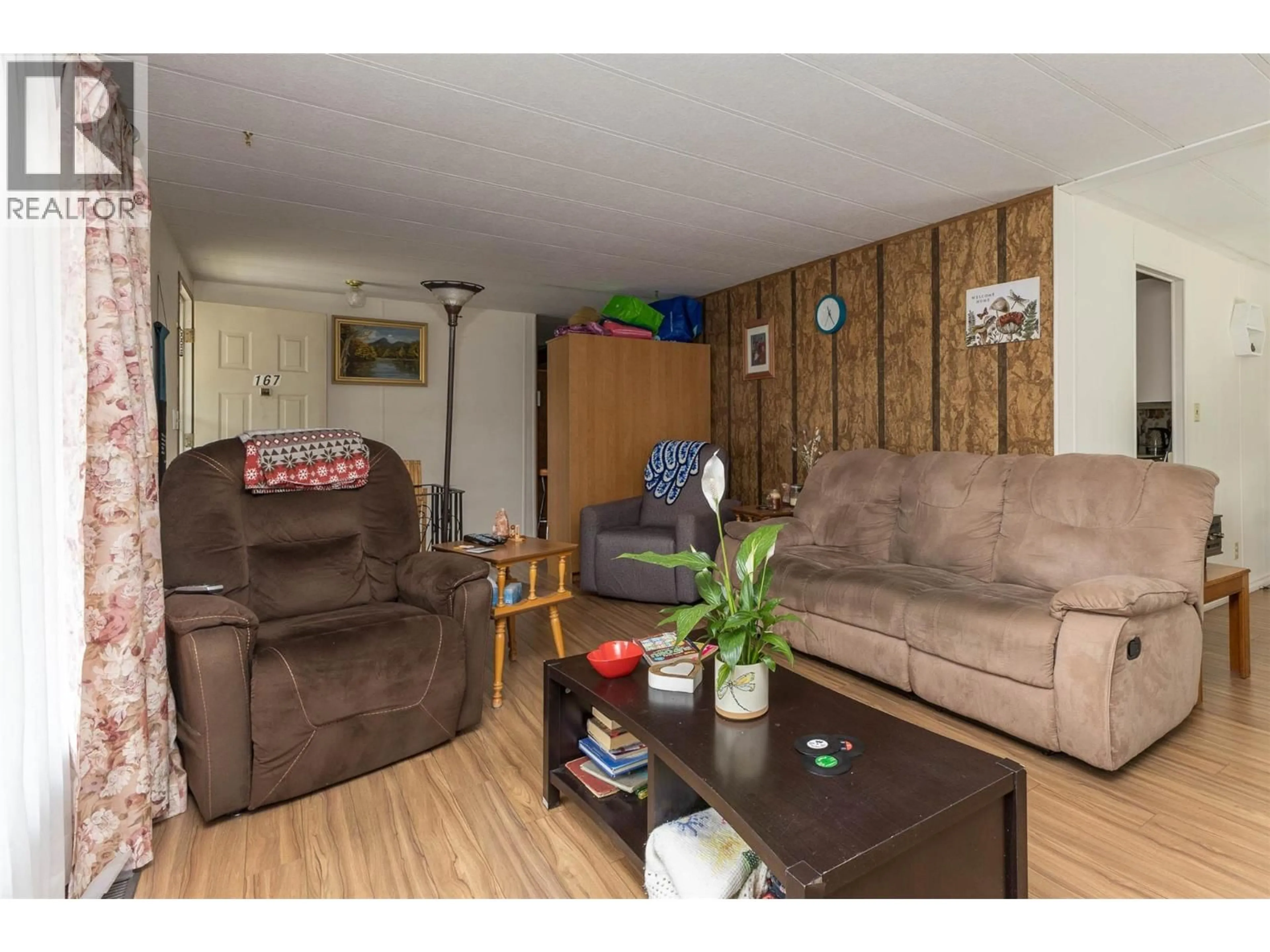 Living room with furniture, wood/laminate floor for 167 - 2500 97B HIGHWAY SOUTHEAST, Salmon Arm British Columbia V1E1C3