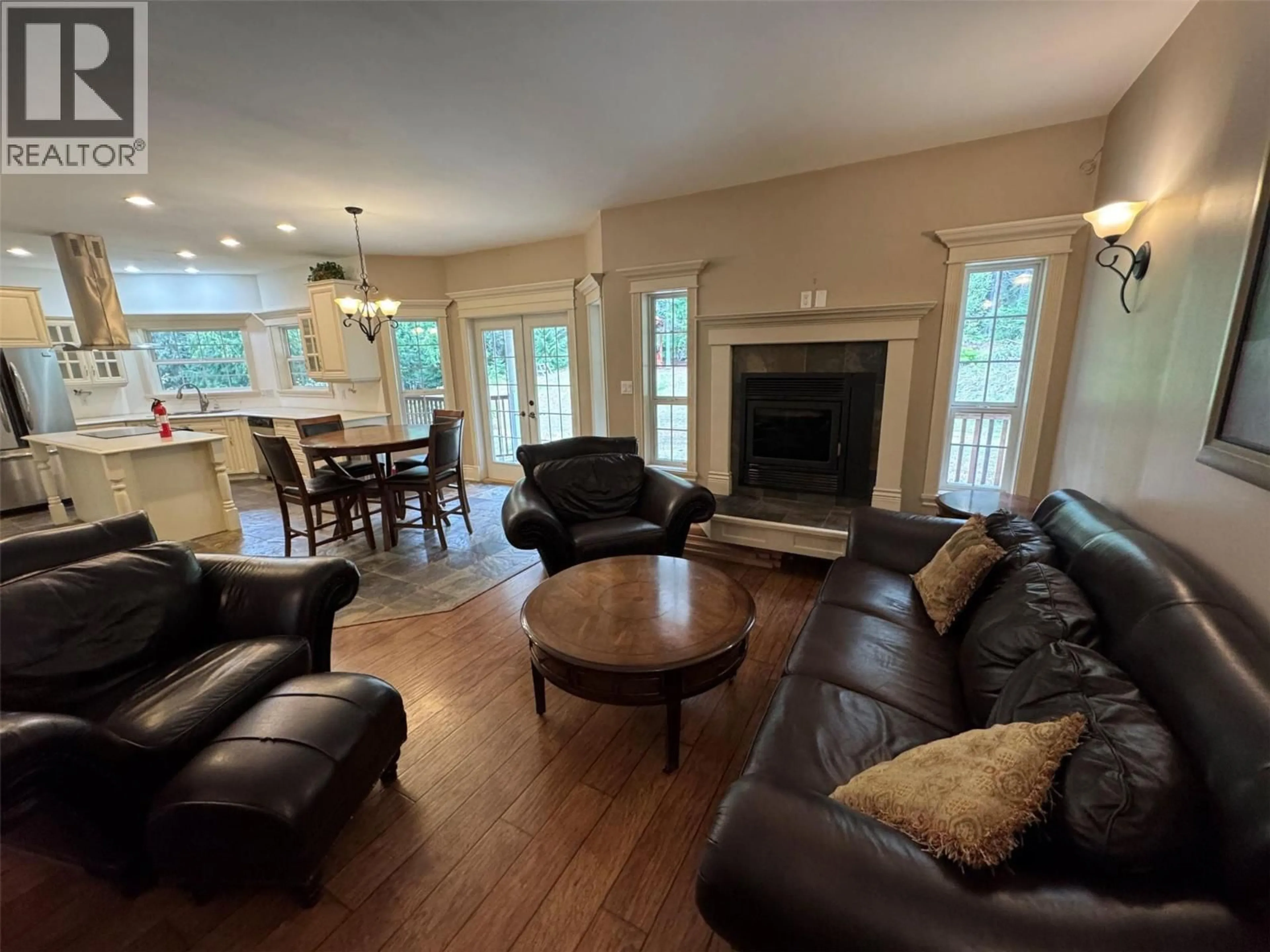Living room with furniture, wood/laminate floor for 6016 ATHELSTON - HARTFORD ROAD, Grand Forks British Columbia V0H1H5