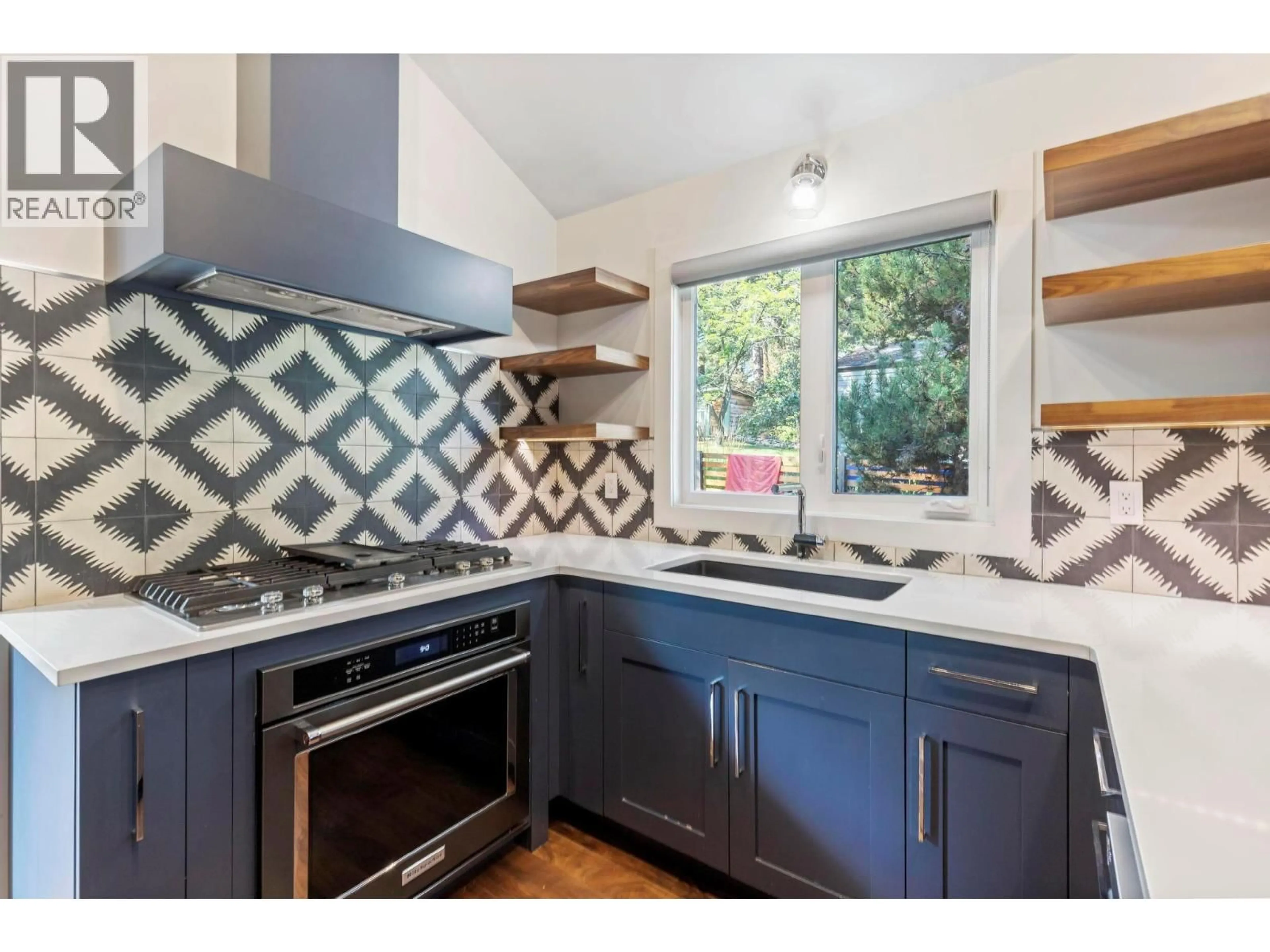 Contemporary kitchen, ceramic/tile floor for 612 THORNELOE ROAD, Kelowna British Columbia V1W4P6