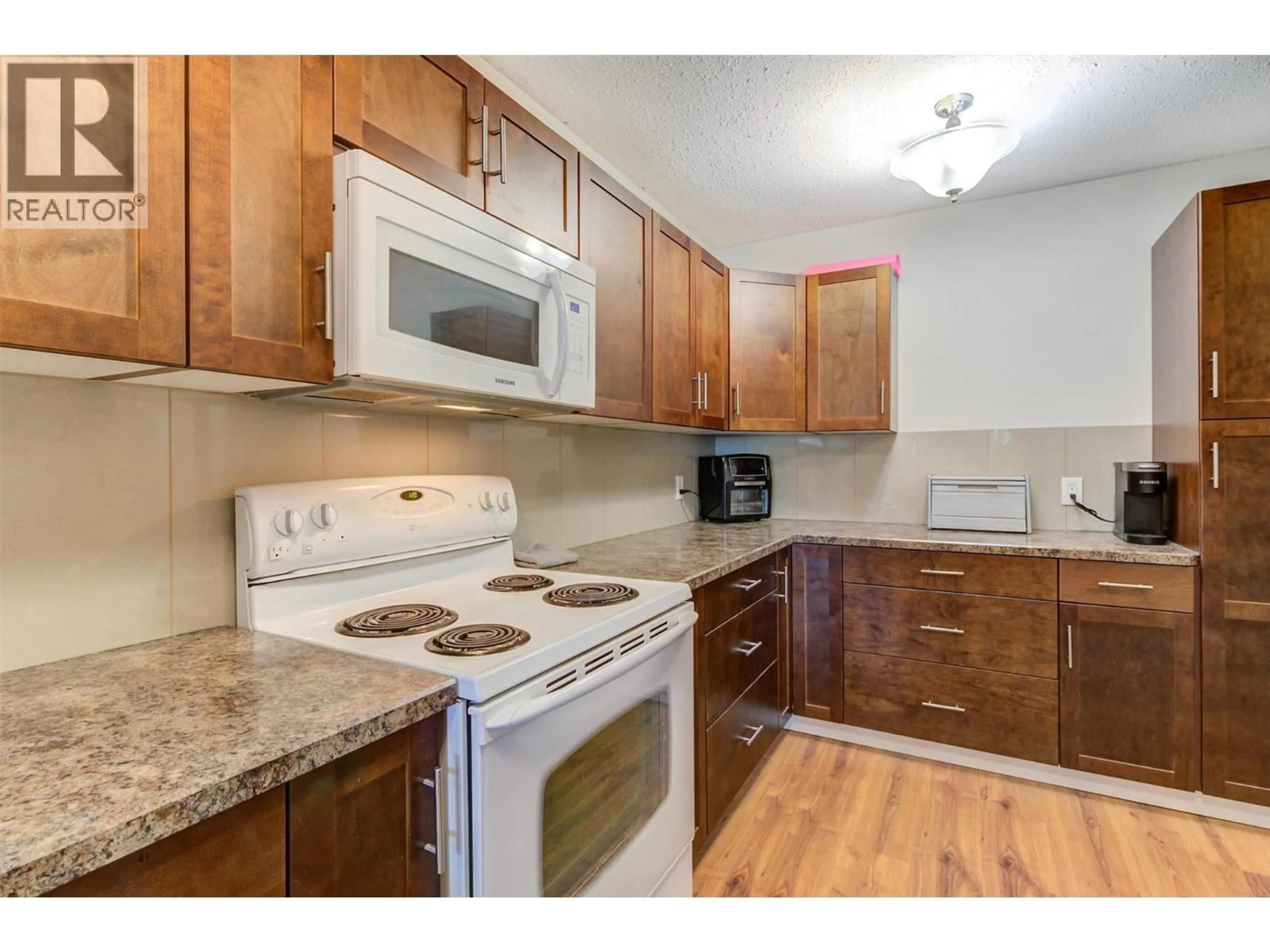 Standard kitchen, wood/laminate floor for #333 - 1665 UFTON COURT, Kelowna British Columbia V1Y8G7