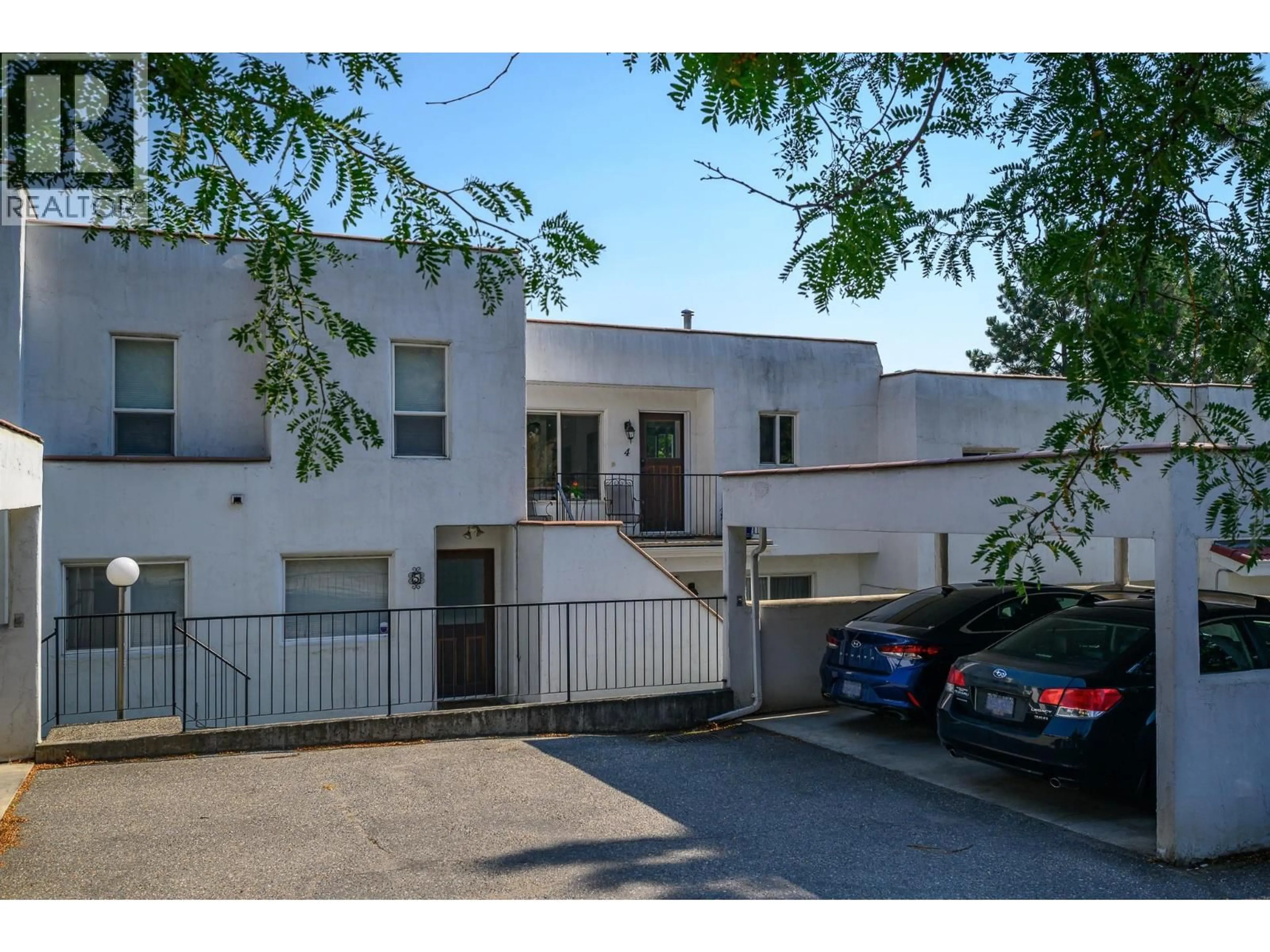 A pic from outside/outdoor area/front of a property/back of a property/a pic from drone, street for 4 - 3901 35 AVENUE, Vernon British Columbia V1T2V1