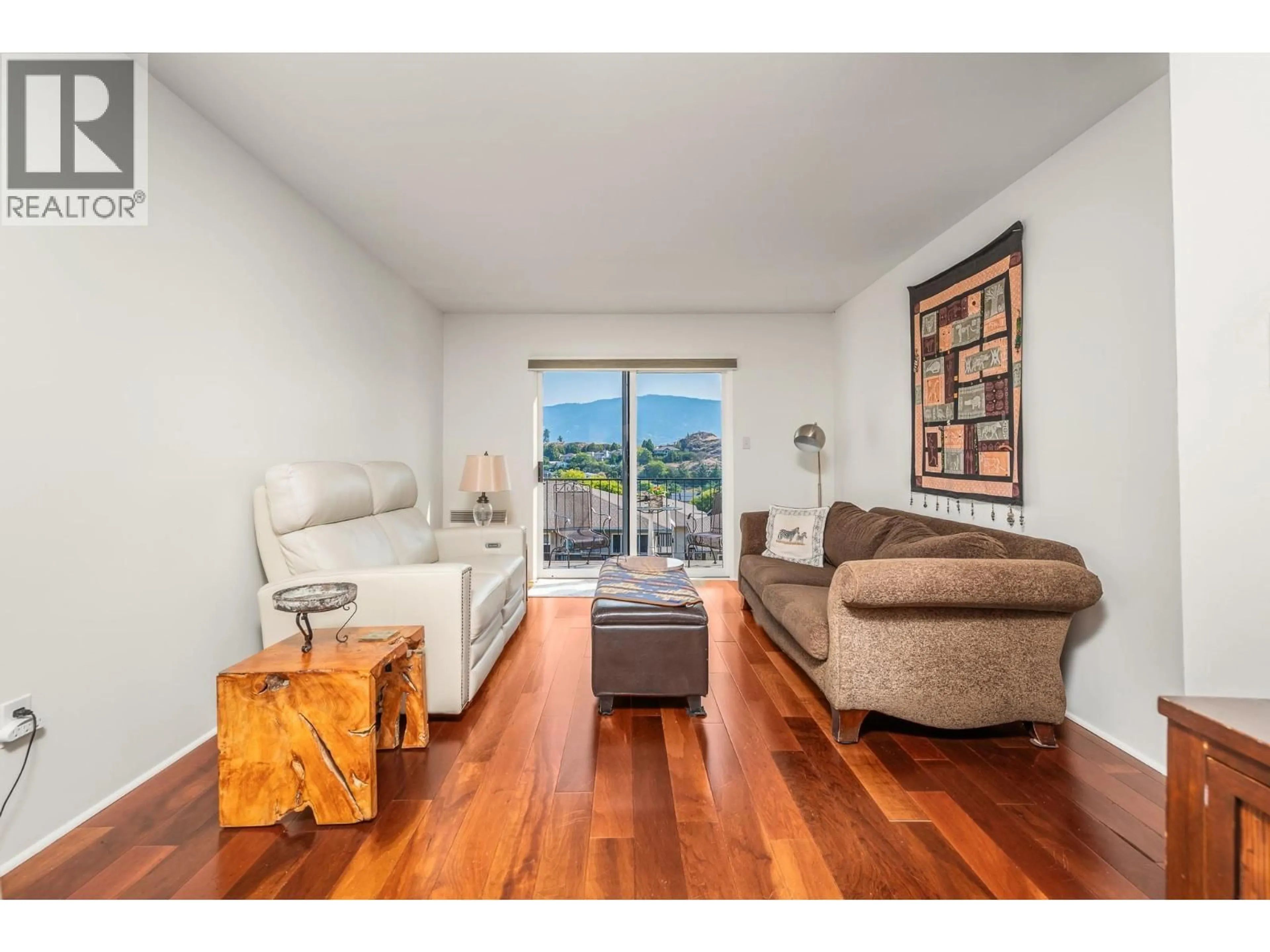Living room with furniture, wood/laminate floor for 4 - 3901 35 AVENUE, Vernon British Columbia V1T2V1