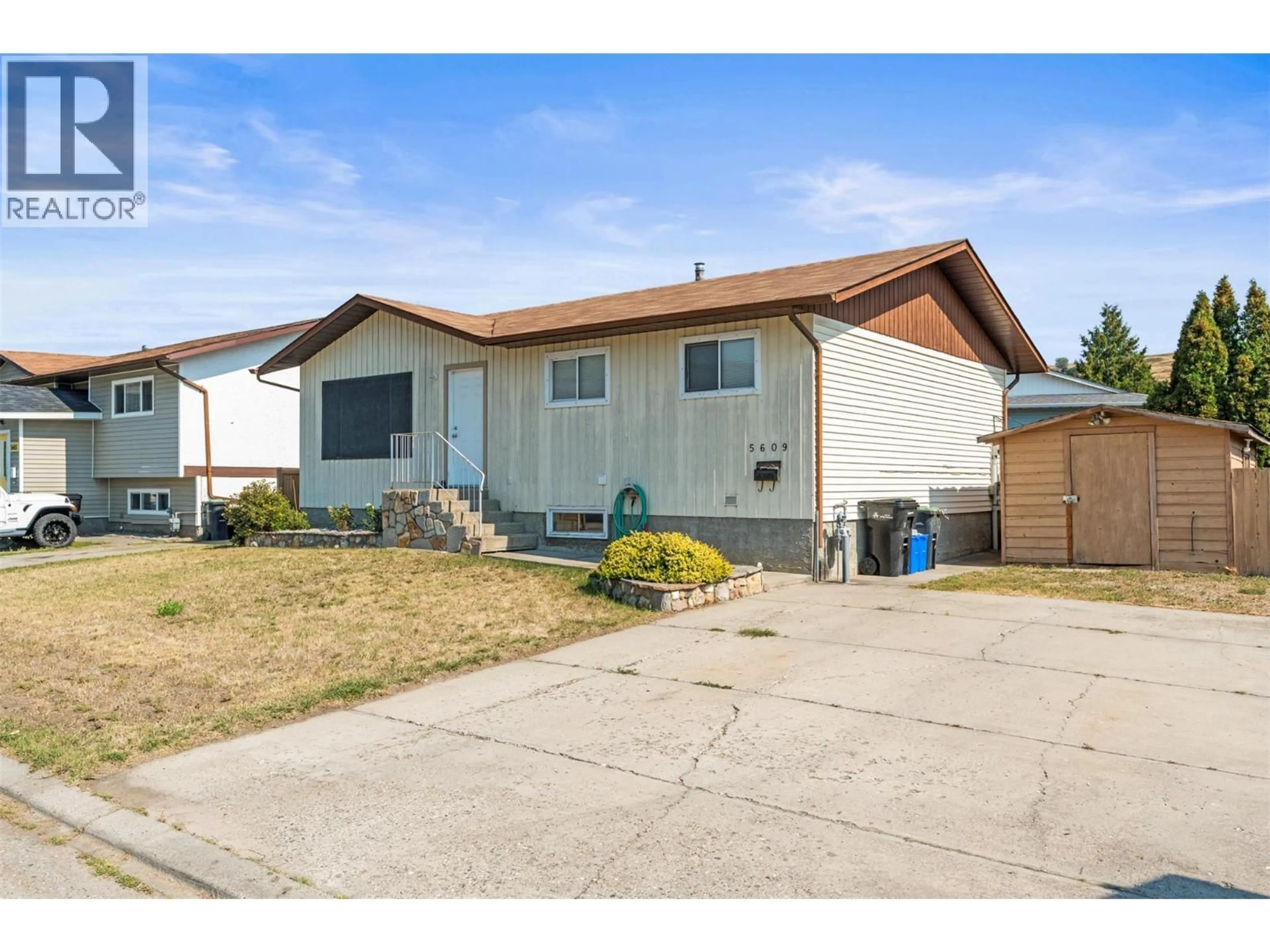 Home with vinyl exterior material, street for 5609 WILLOW PLACE, Vernon British Columbia V1T8N9