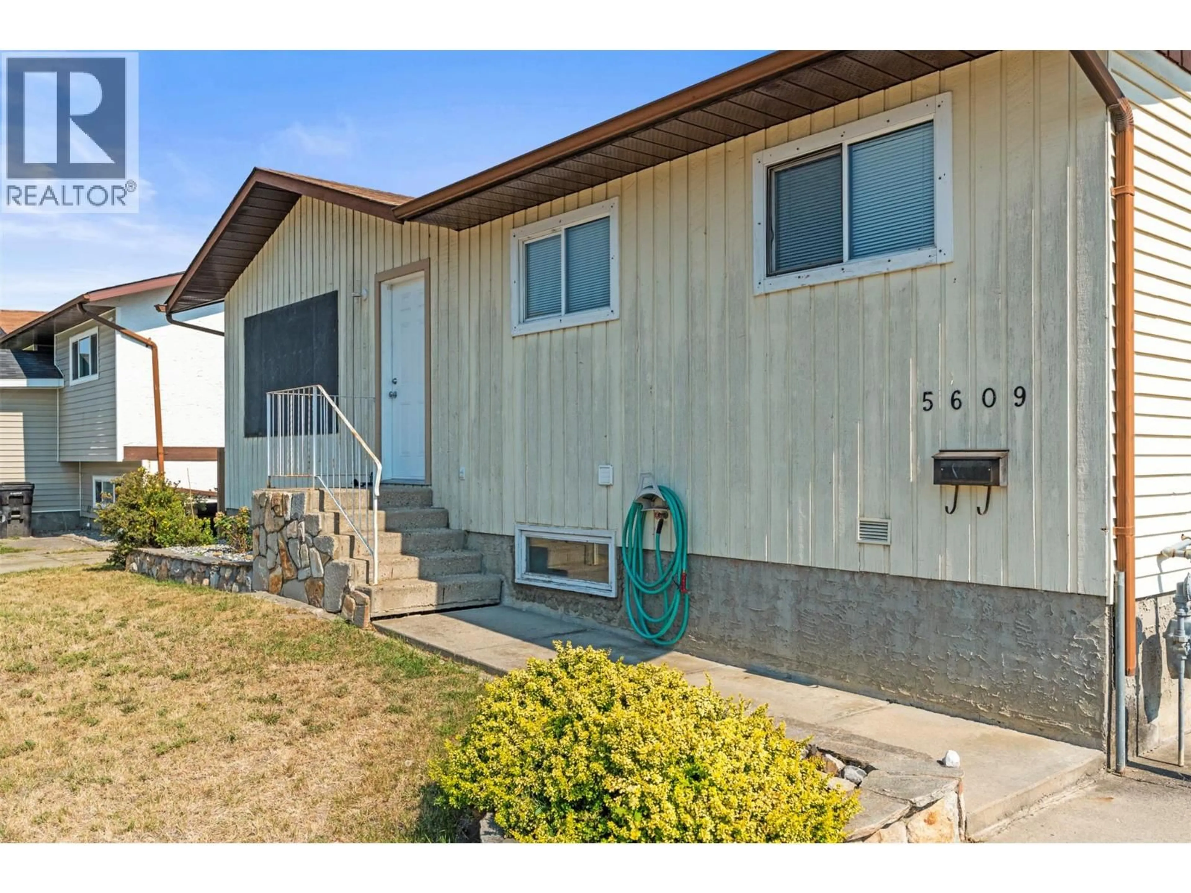 Home with vinyl exterior material, street for 5609 WILLOW PLACE, Vernon British Columbia V1T8N9