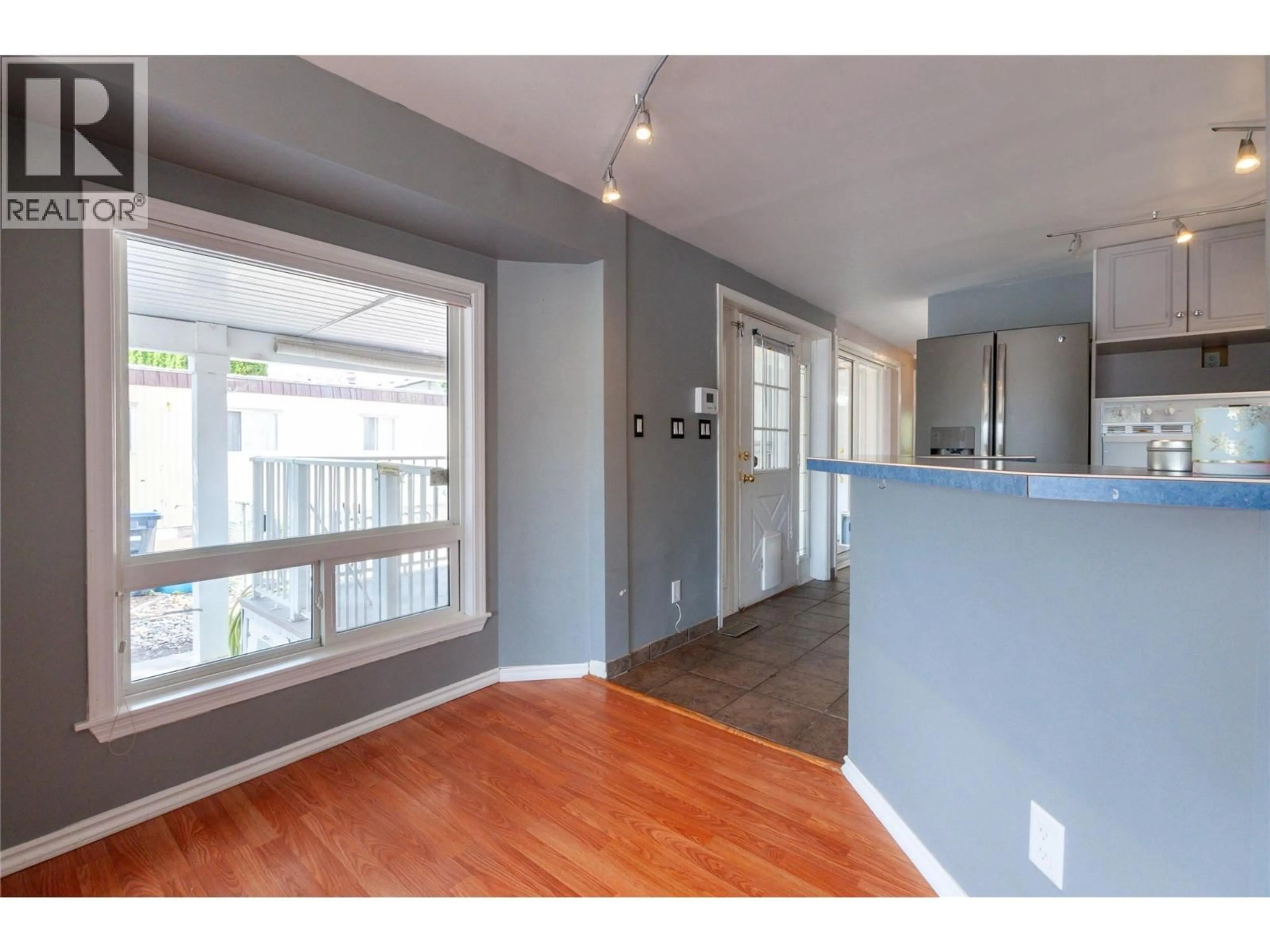 Open concept kitchen, wood/laminate floor for 95 - 3245 PARIS STREET, Penticton British Columbia V2A3T9