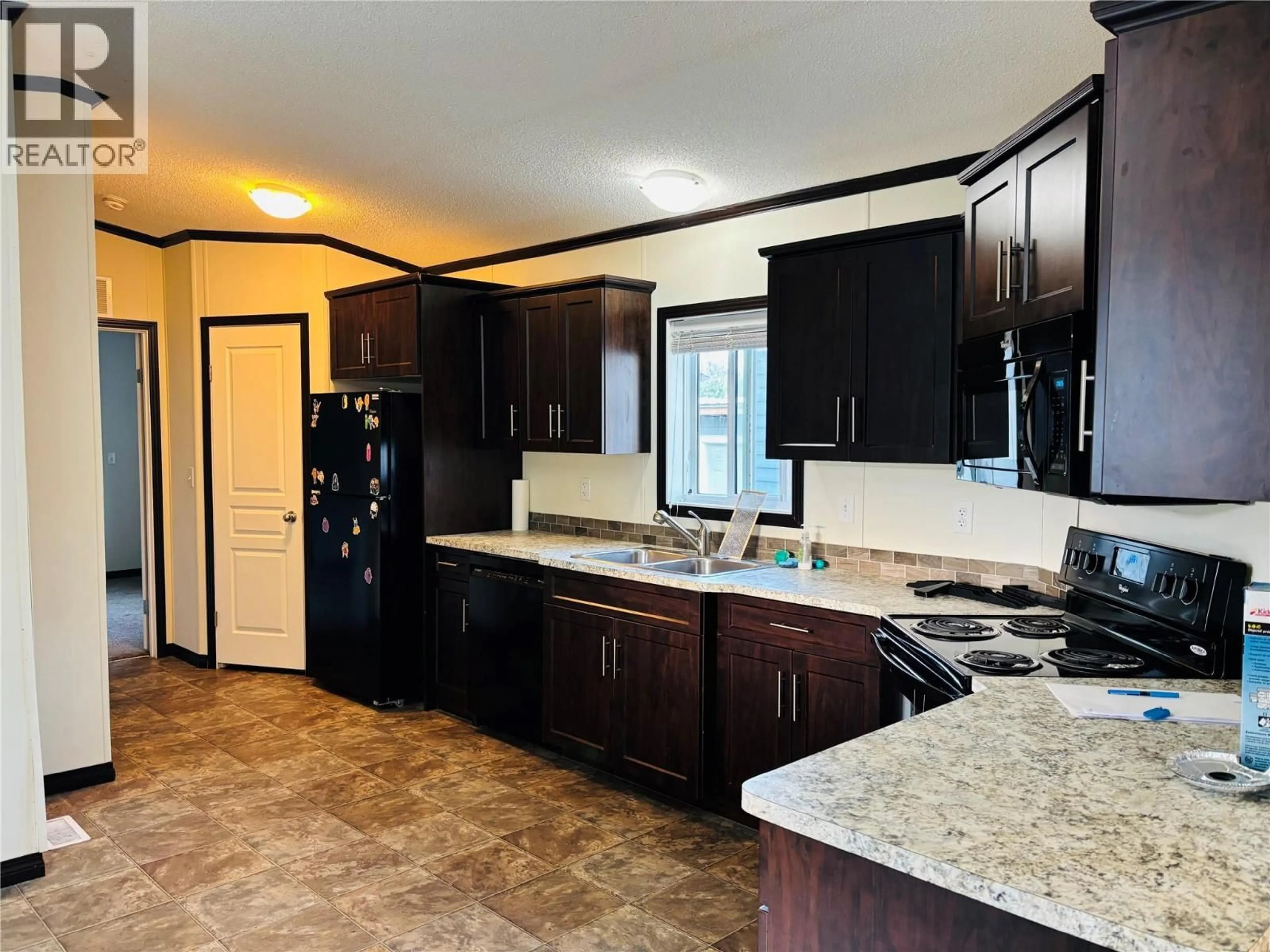 Open concept kitchen, ceramic/tile floor for 74 - 1200 OSCAR STREET, Revelstoke British Columbia V0E2S0