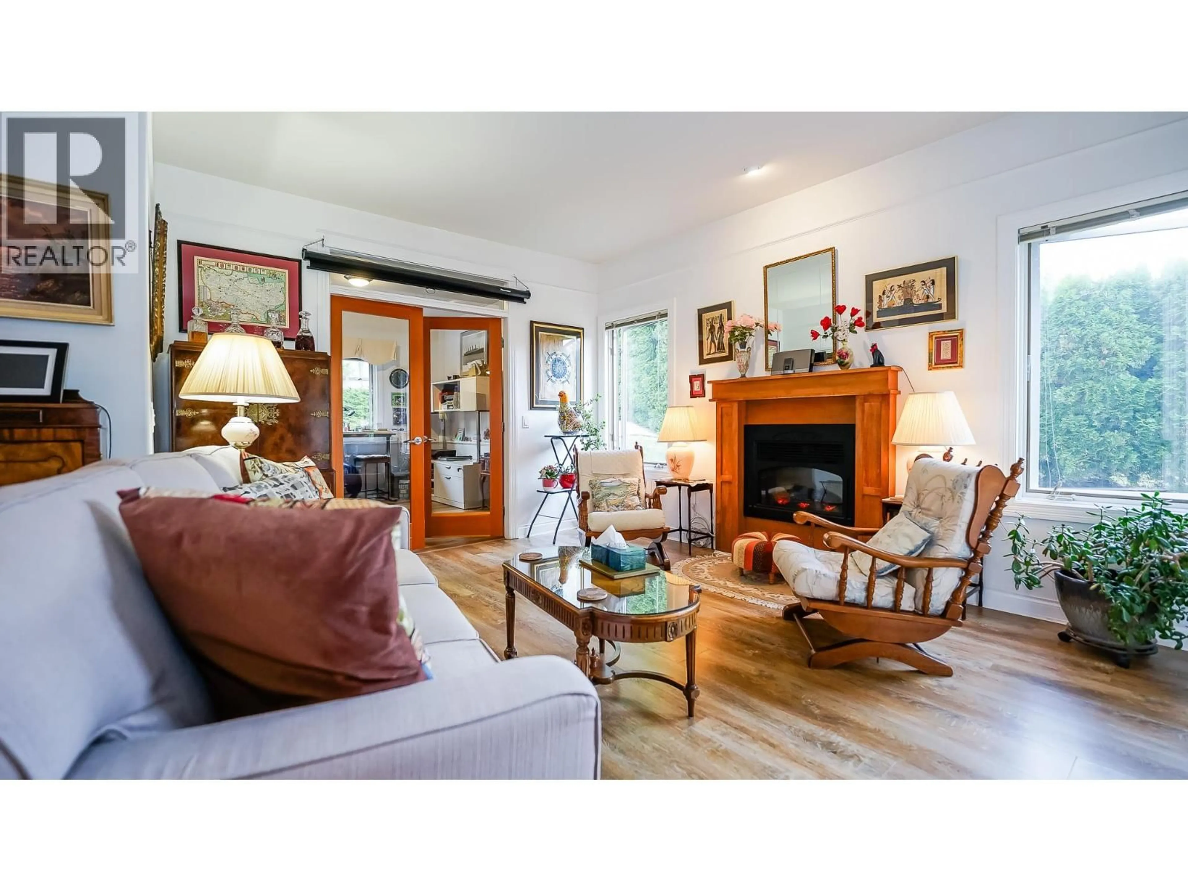 Living room with furniture, wood/laminate floor for 104 - 1391 10 AVENUE NORTHEAST, Salmon Arm British Columbia V1E4N1