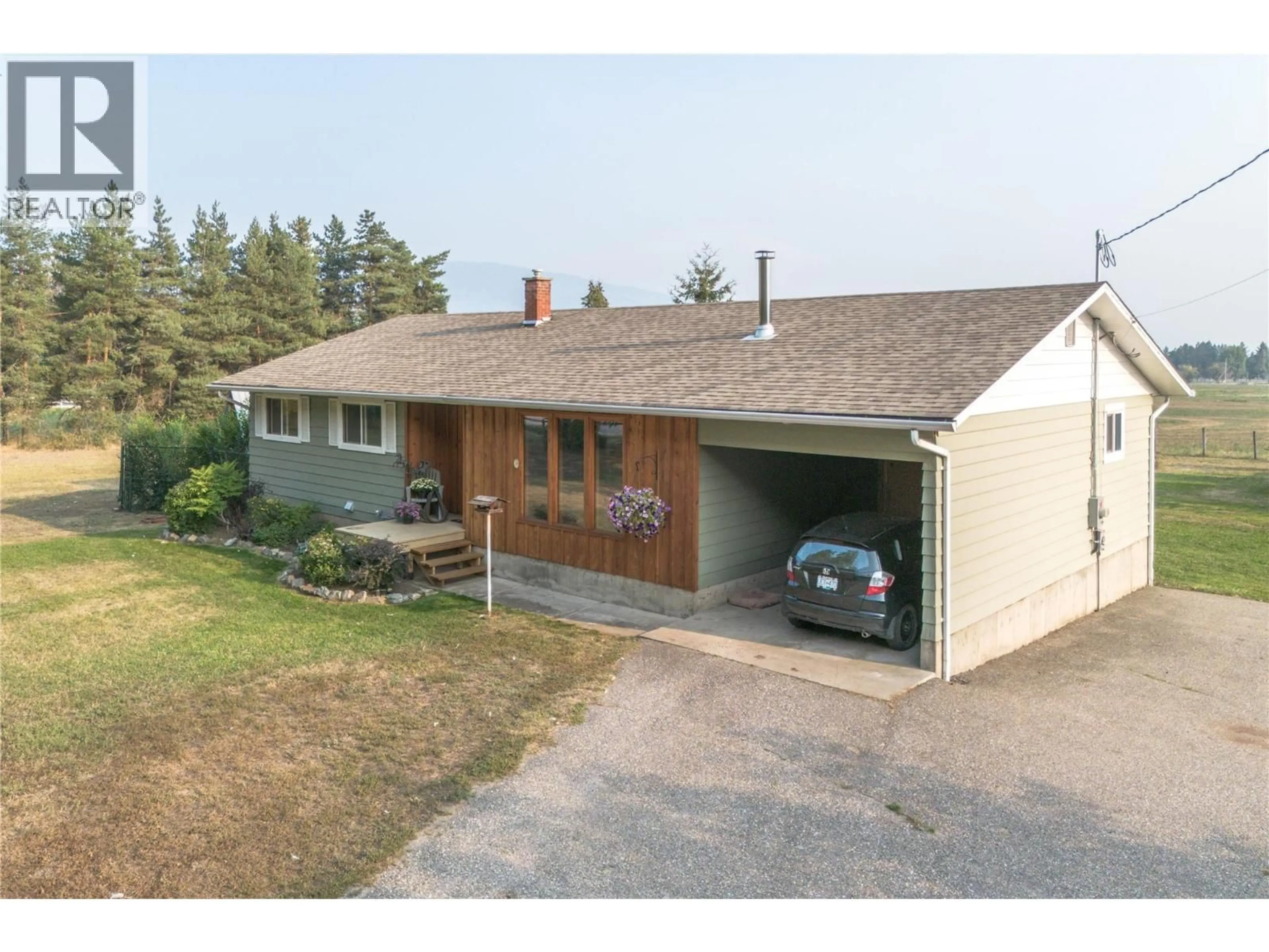 A pic from outside/outdoor area/front of a property/back of a property/a pic from drone, street for 4715 GRANDVIEW FLATS ROAD, Spallumcheen British Columbia V4Y0P8