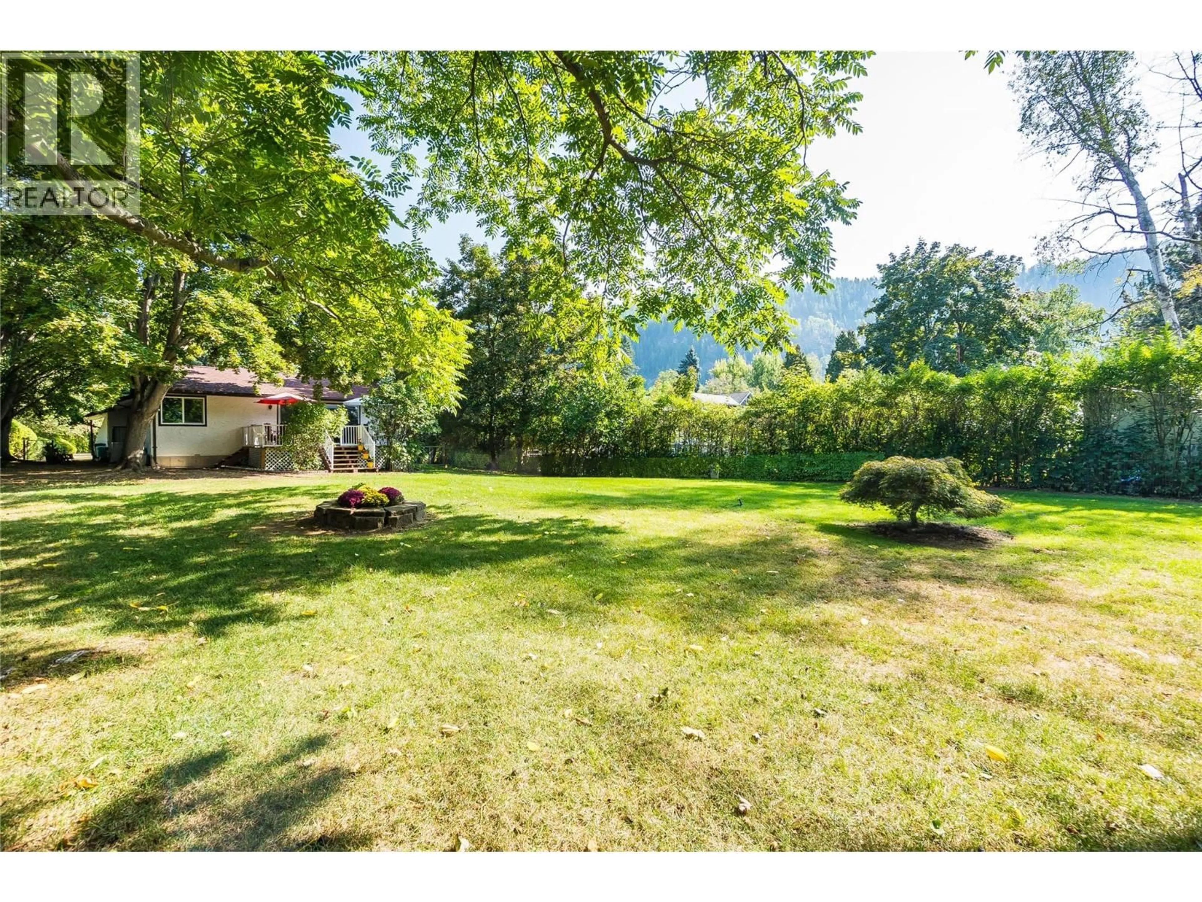 A pic from outside/outdoor area/front of a property/back of a property/a pic from drone, forest/trees view for 144 100TH STREET, Castlegar British Columbia V1N3C5