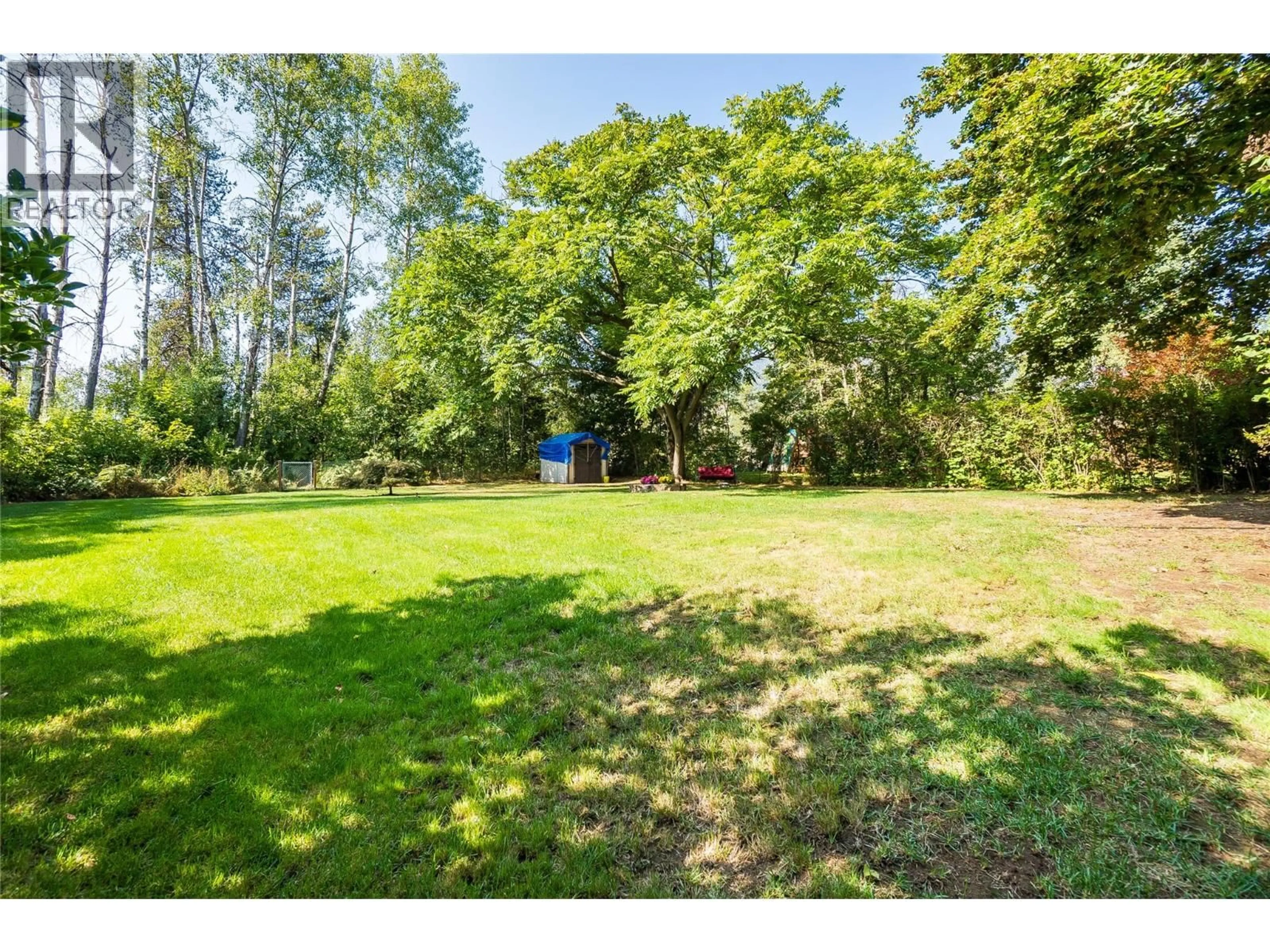 A pic from outside/outdoor area/front of a property/back of a property/a pic from drone, forest/trees view for 144 100TH STREET, Castlegar British Columbia V1N3C5