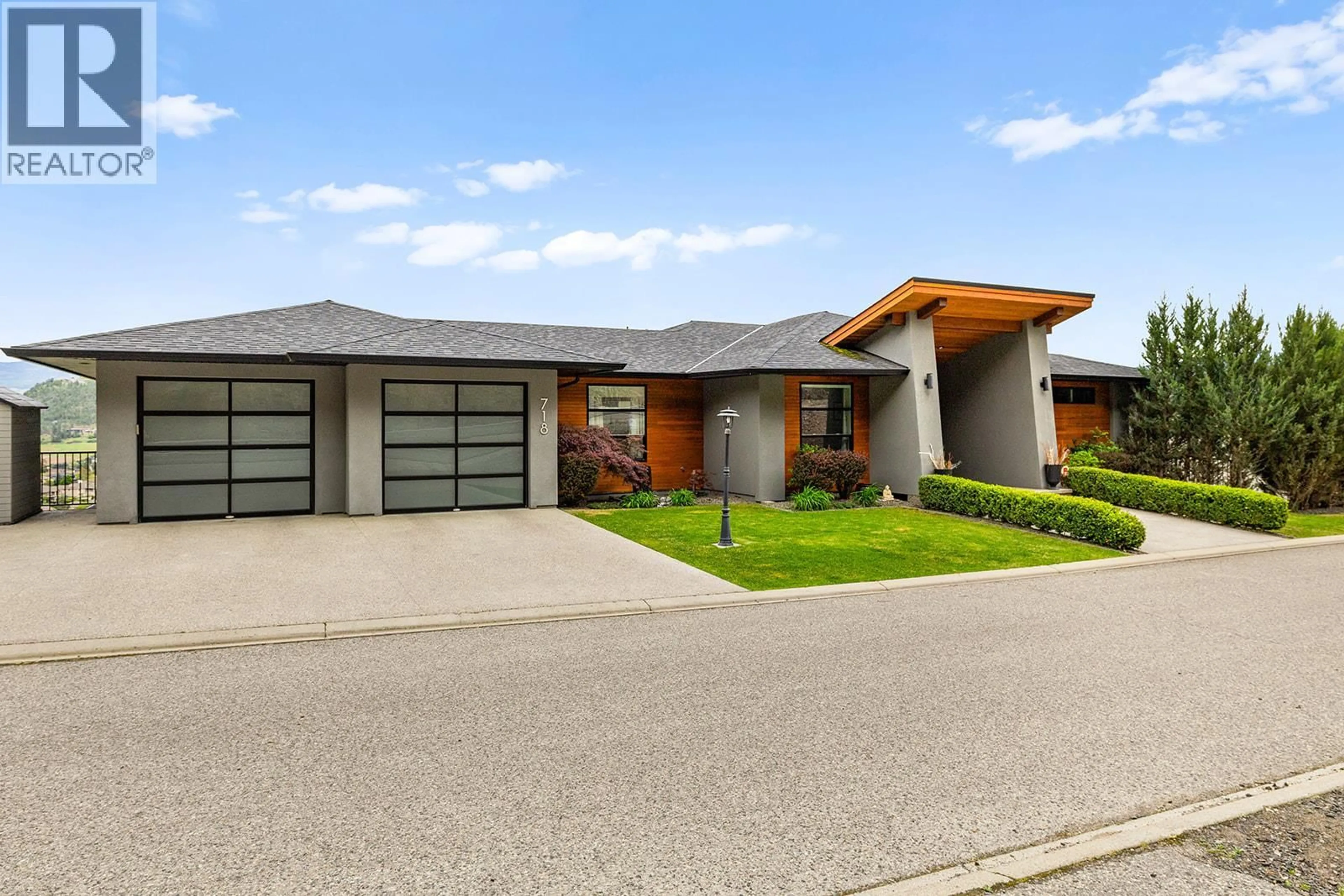 Home with brick exterior material, street for 718 HIGHPOINTE DRIVE, Kelowna British Columbia V1V2Y1
