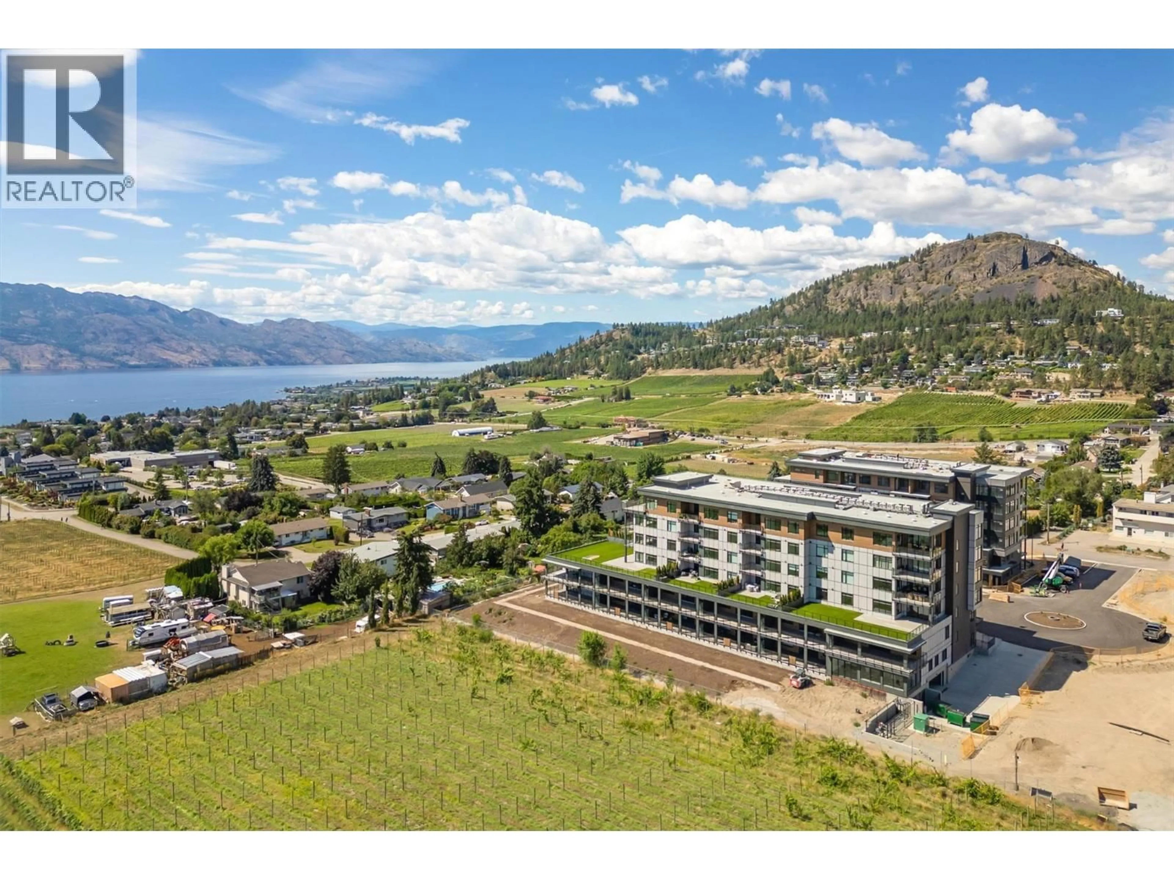 A pic from outside/outdoor area/front of a property/back of a property/a pic from drone, water/lake/river/ocean view for 307 - 2780 OLALLA ROAD, West Kelowna British Columbia V1Z2A9