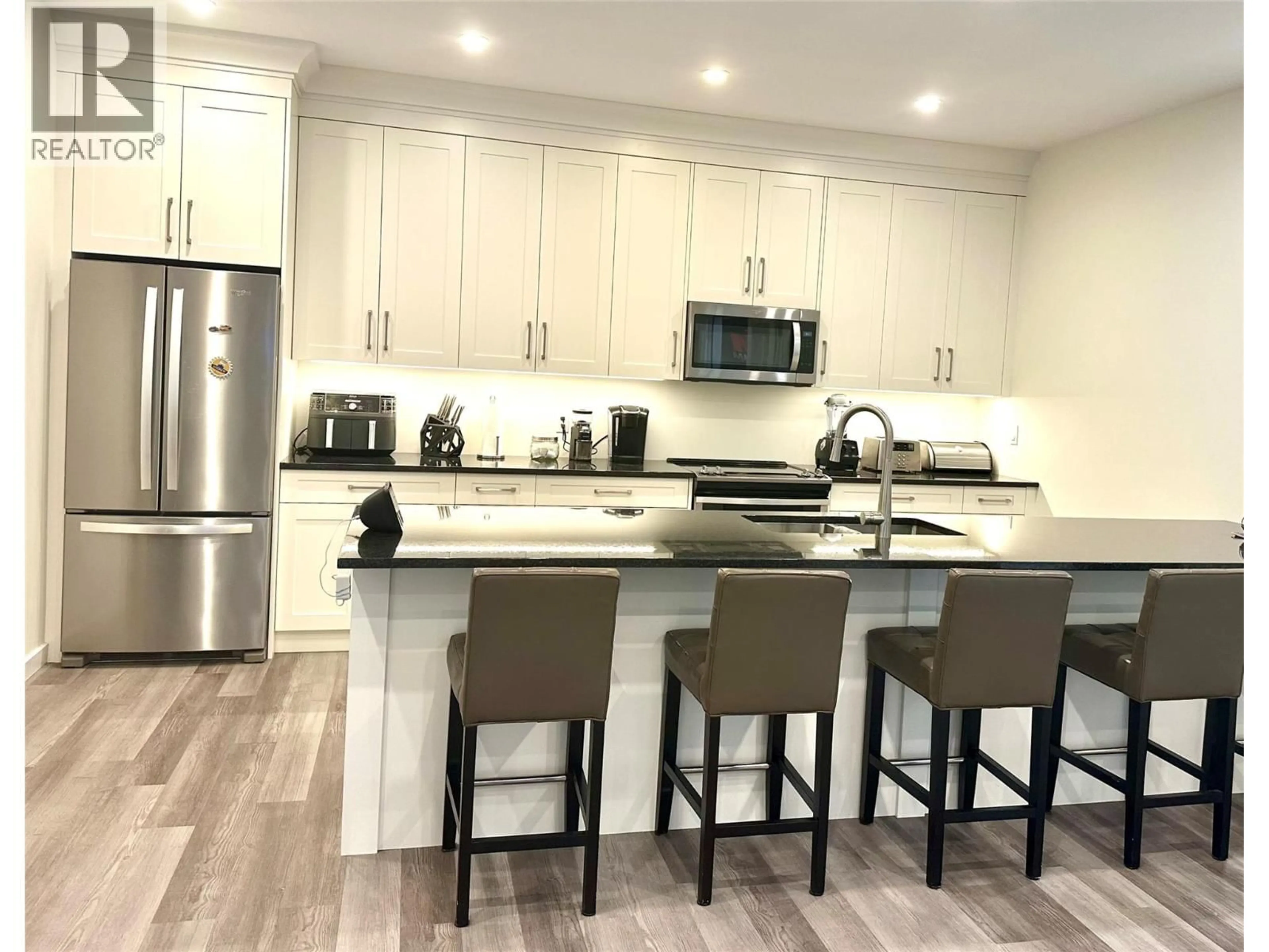 Open concept kitchen, wood/laminate floor for POWERHOUSE ROAD, Revelstoke British Columbia V0E2S0