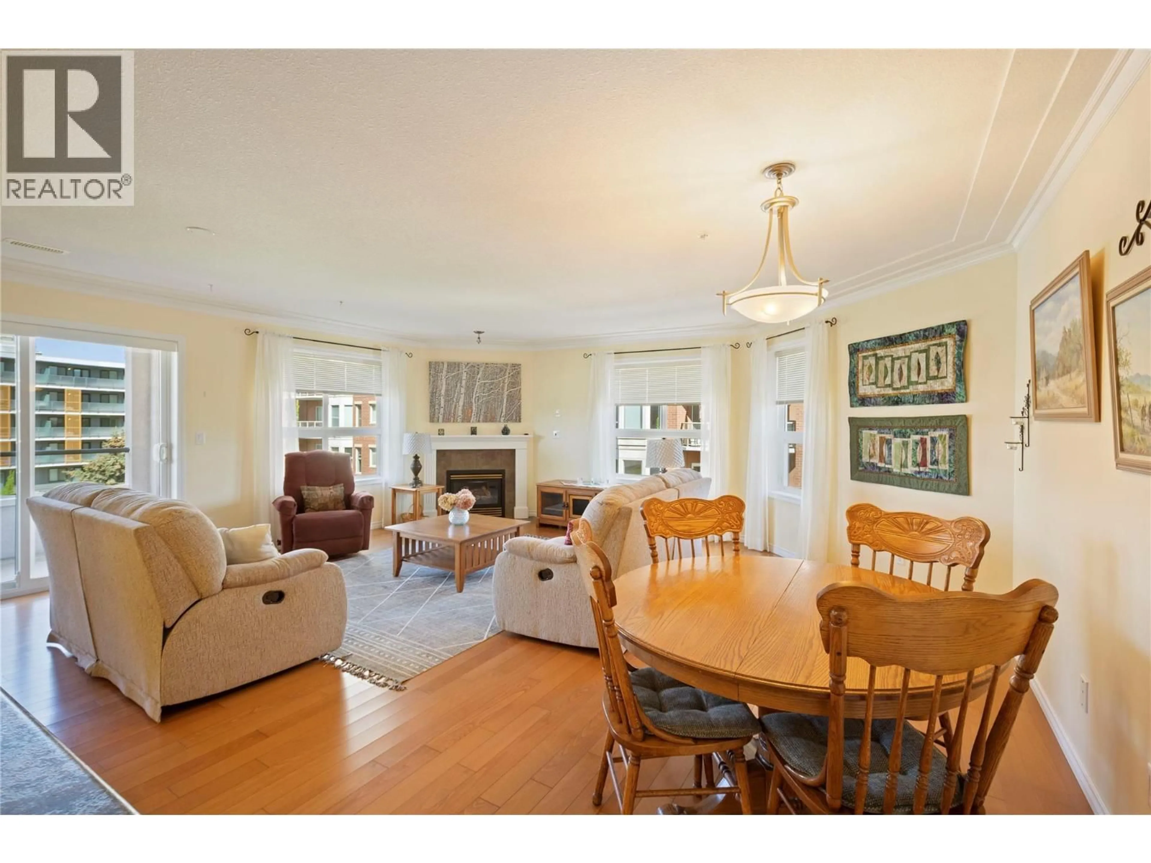 Living room with furniture, wood/laminate floor for 401 - 1967 UNDERHILL STREET, Kelowna British Columbia V1X8C9