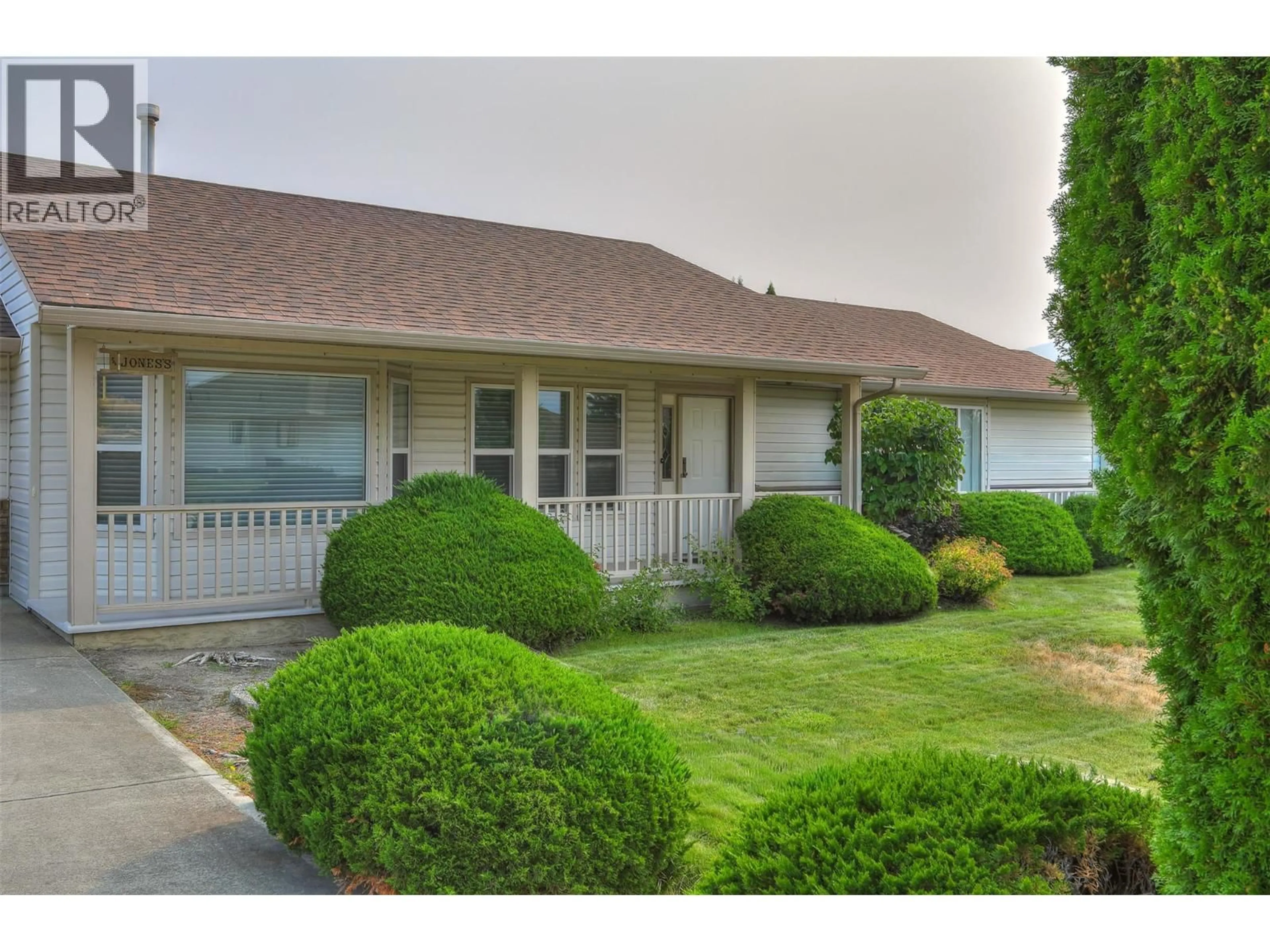 Home with vinyl exterior material, street for 3897 DESERT PINES AVENUE, Peachland British Columbia V0H1X2
