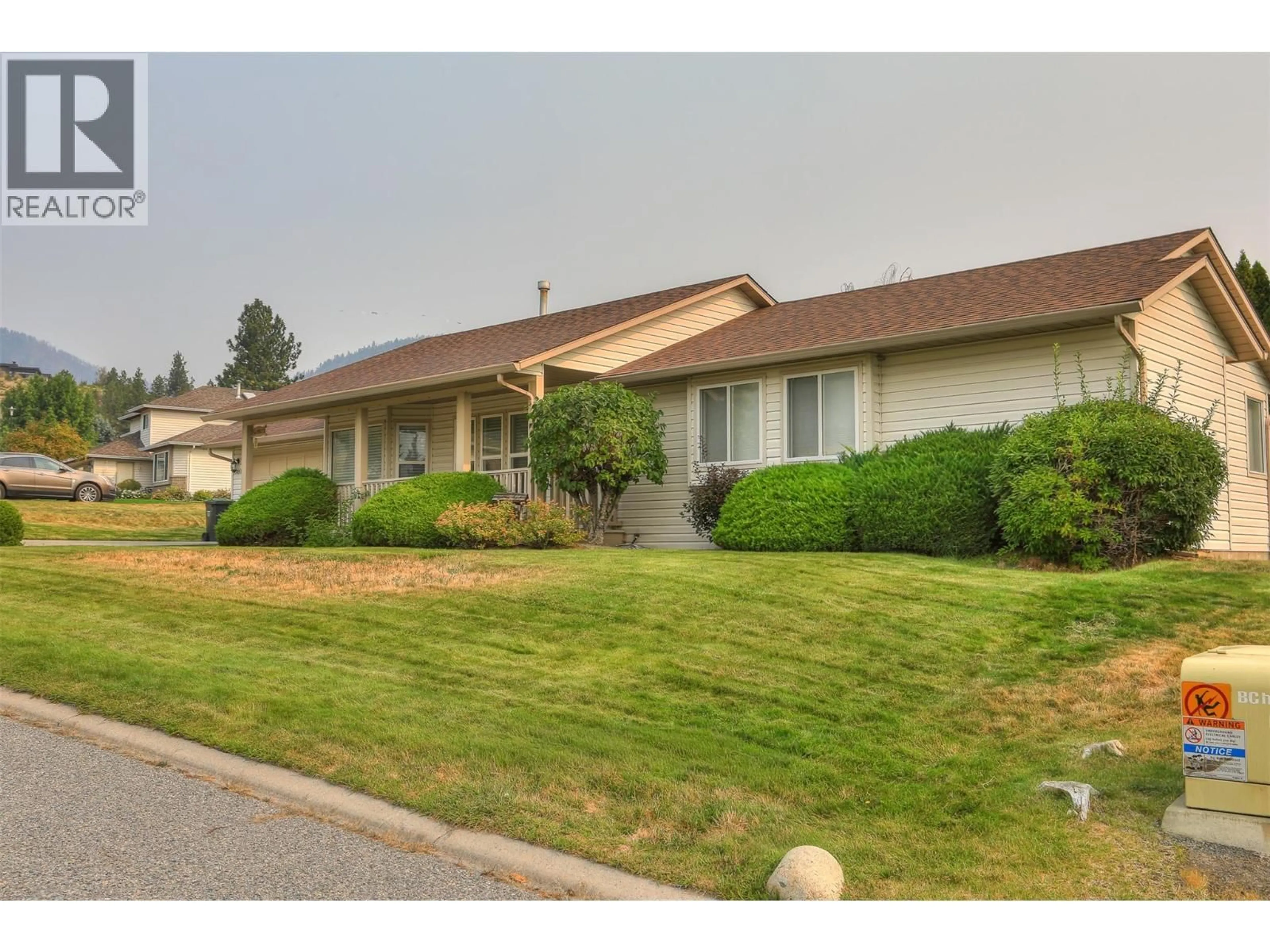Home with vinyl exterior material, street for 3897 DESERT PINES AVENUE, Peachland British Columbia V0H1X2