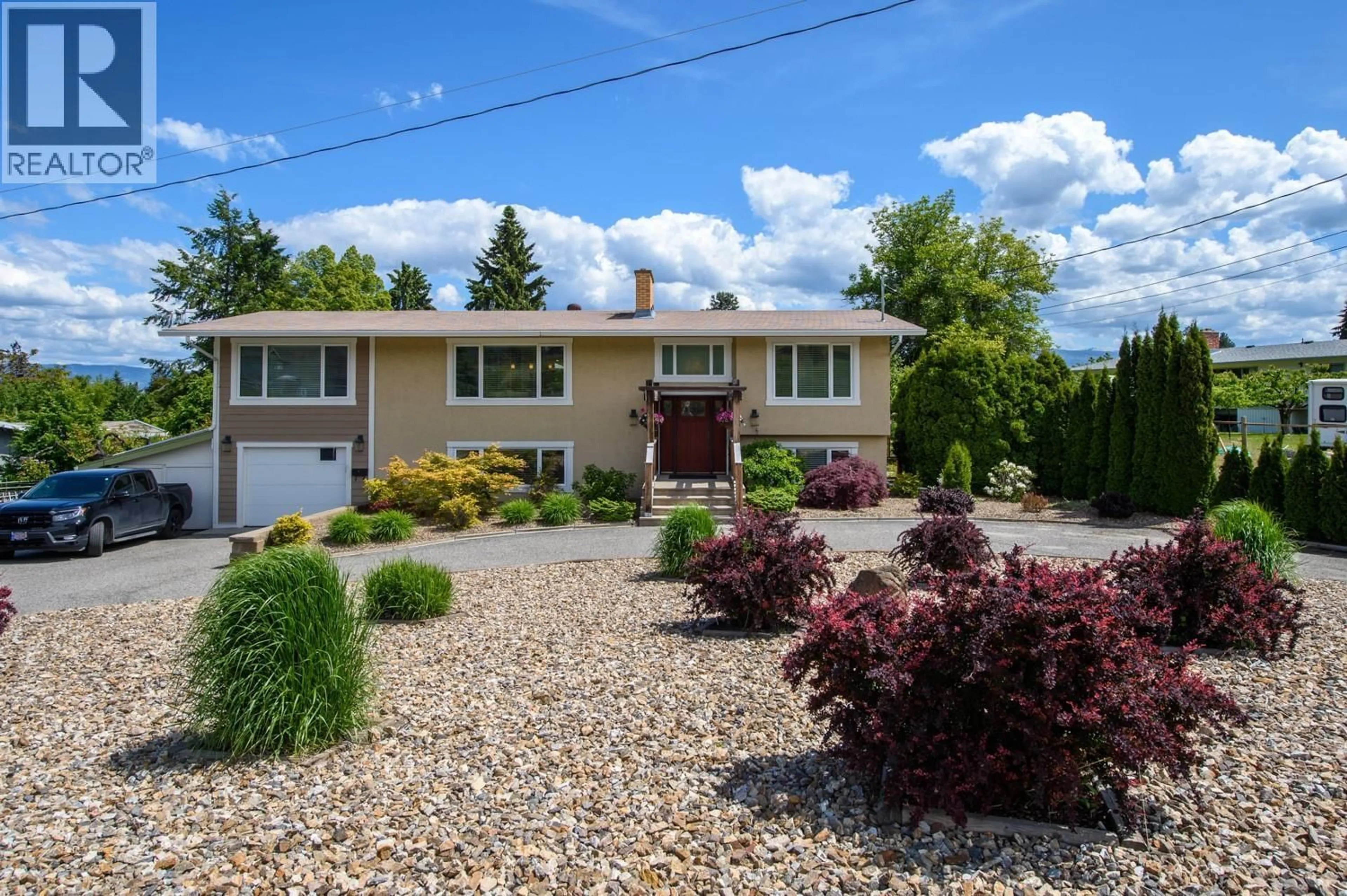 Home with vinyl exterior material, street for 2475 HAYMAN ROAD, West Kelowna British Columbia V1Z2A1