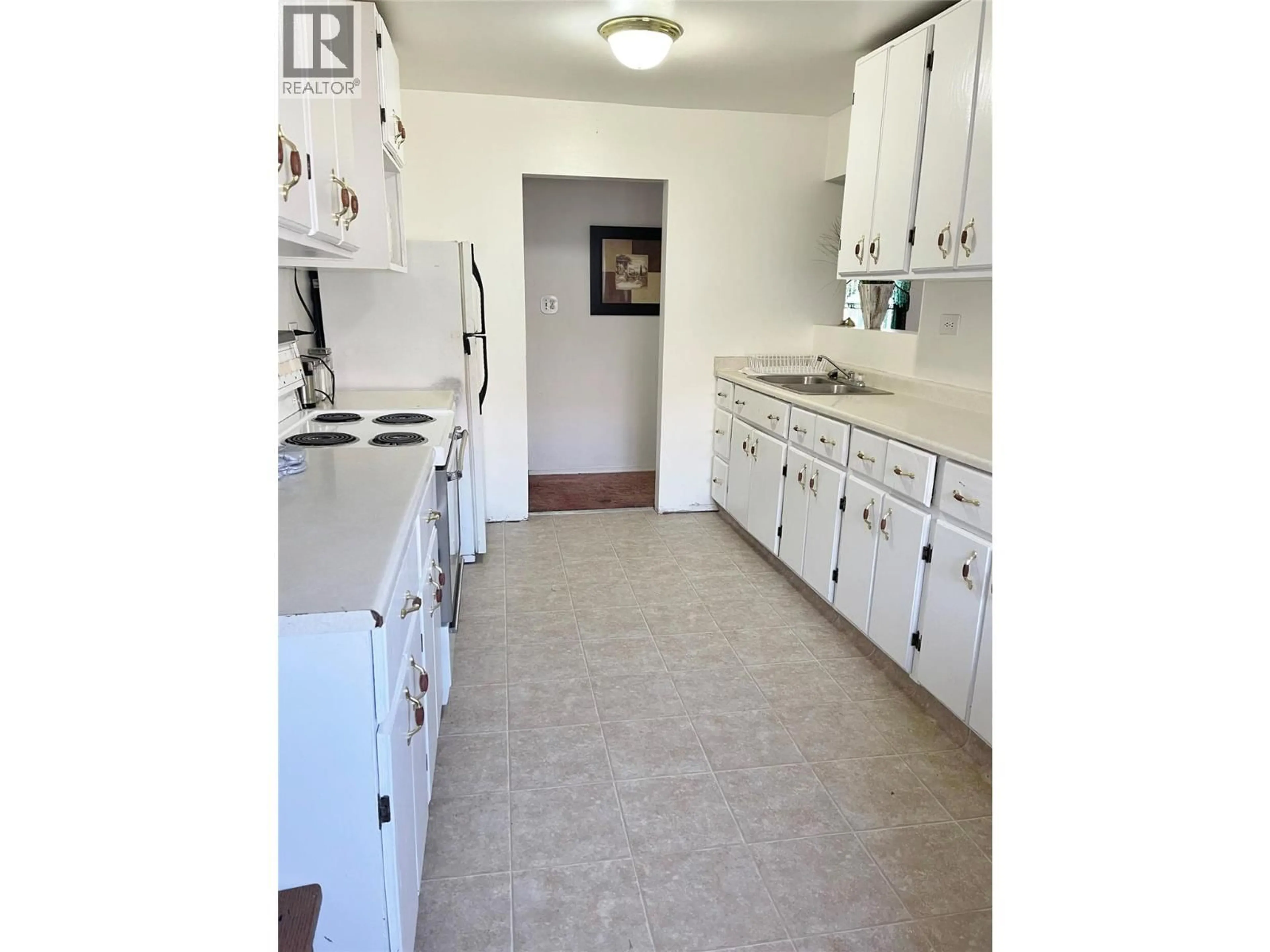 Kitchen with laundary machines, ceramic/tile floor for 222 - 224 VAN HORNE STREET SOUTH, Cranbrook British Columbia V1C1Z4
