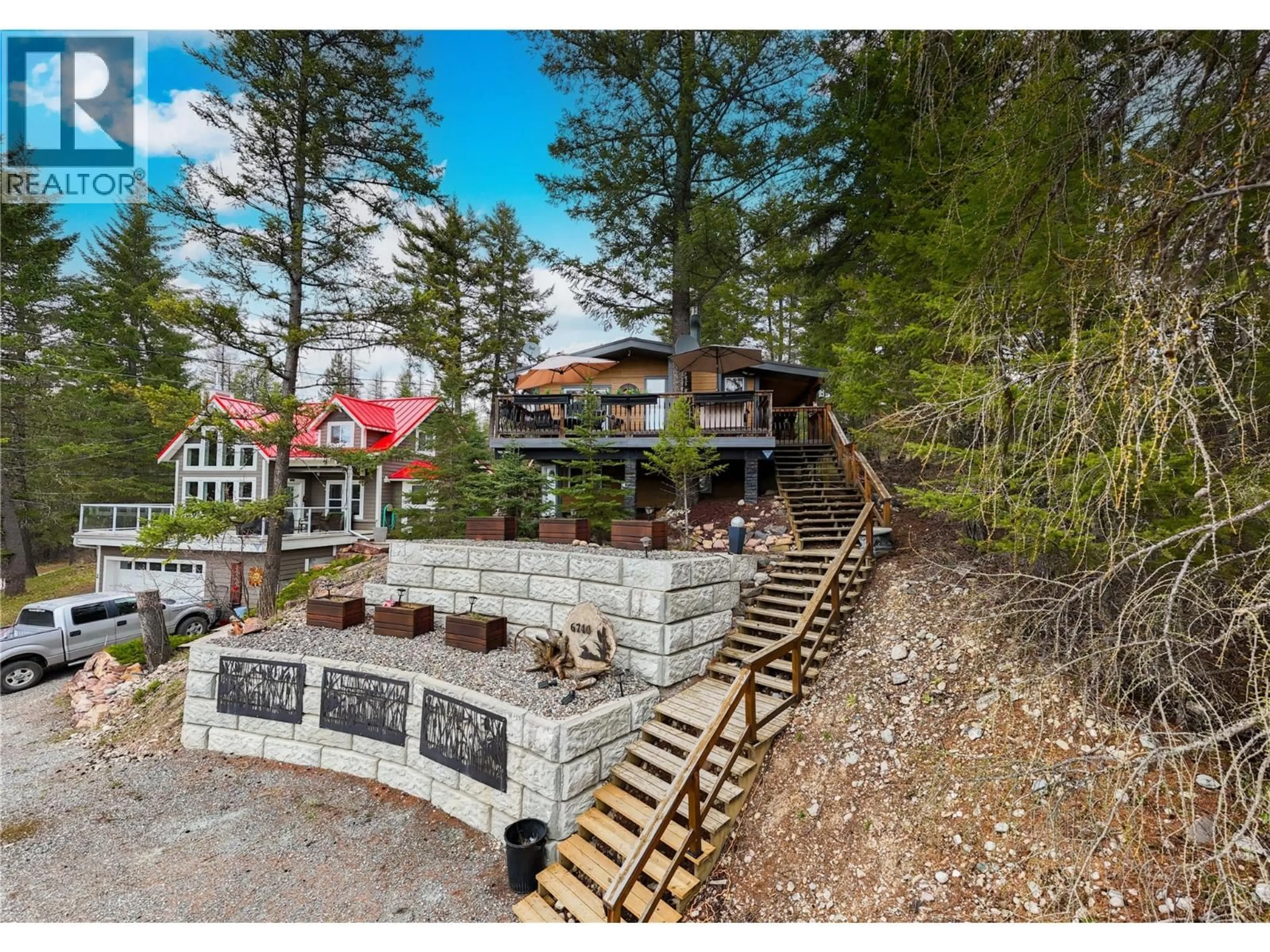 A pic from outside/outdoor area/front of a property/back of a property/a pic from drone, mountain view for 6740 ROSEN LAKE ROAD, Jaffray British Columbia V0B1T0