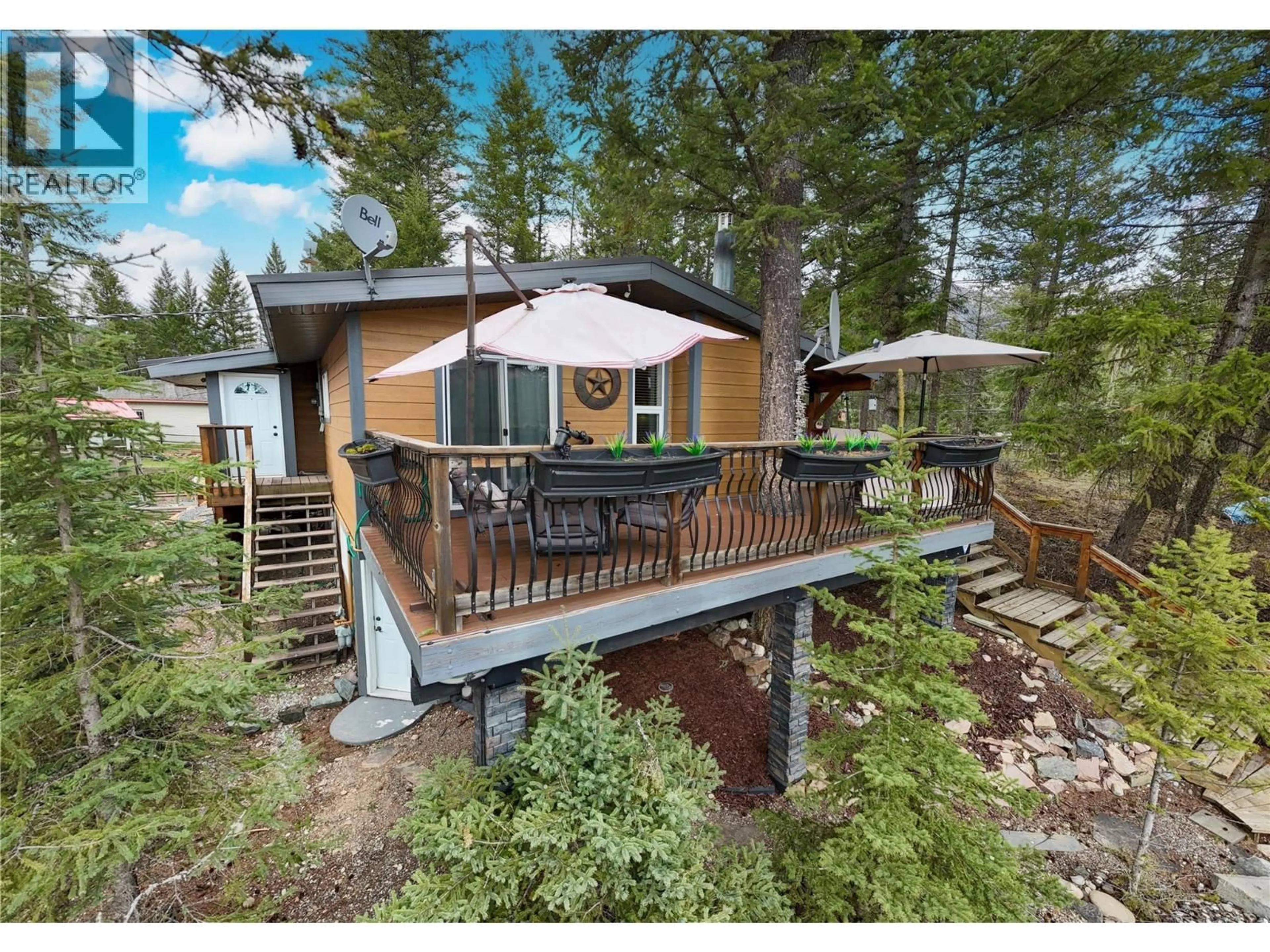 A pic from outside/outdoor area/front of a property/back of a property/a pic from drone, forest/trees view for 6740 ROSEN LAKE ROAD, Jaffray British Columbia V0B1T0