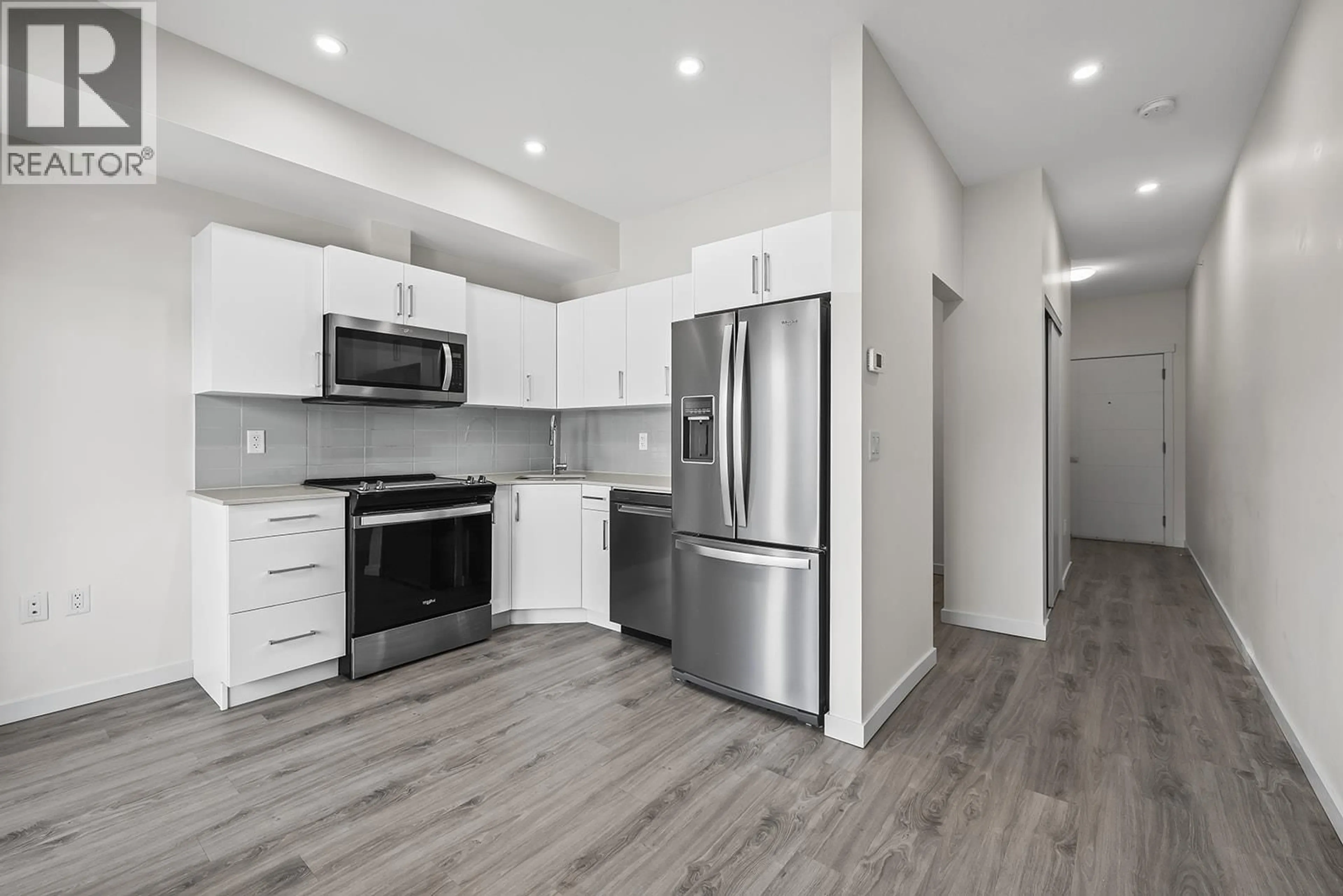 Open concept kitchen, wood/laminate floor for 513 - 2345 BUTT ROAD, West Kelowna British Columbia V4T1N6