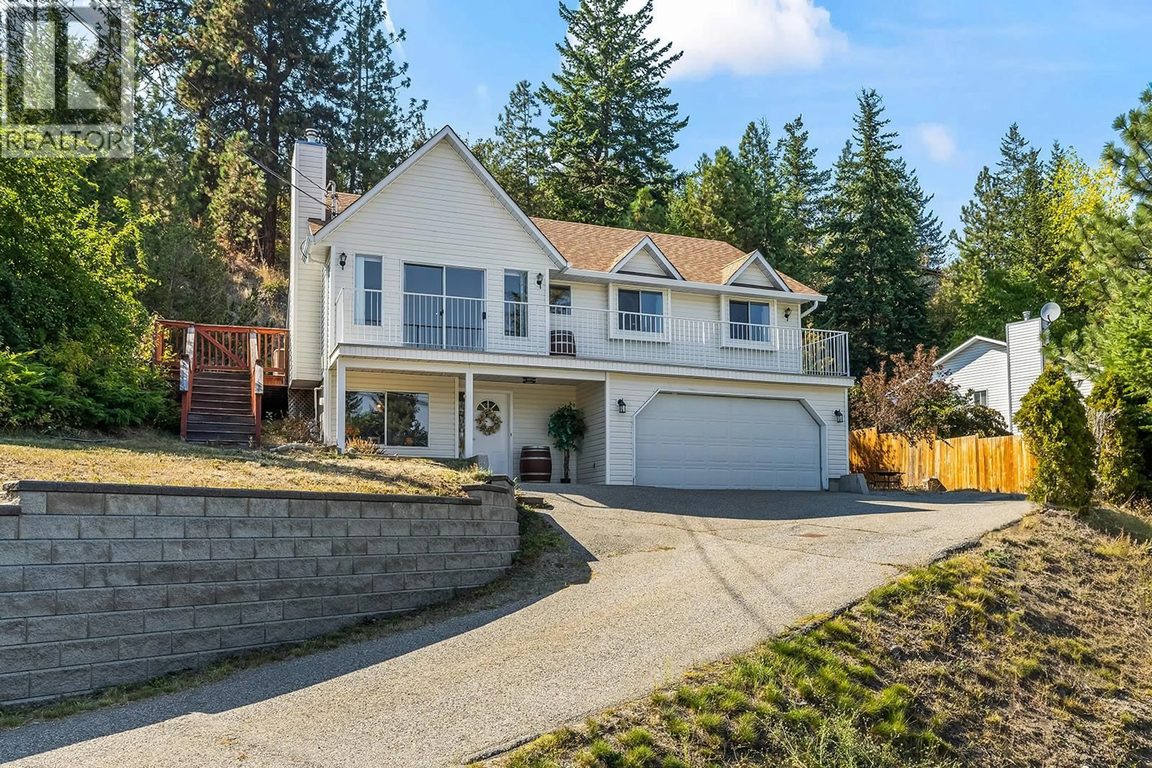 Home with vinyl exterior material, street for 3334 MCQUEEN ROAD, West Kelowna British Columbia V4T1B7
