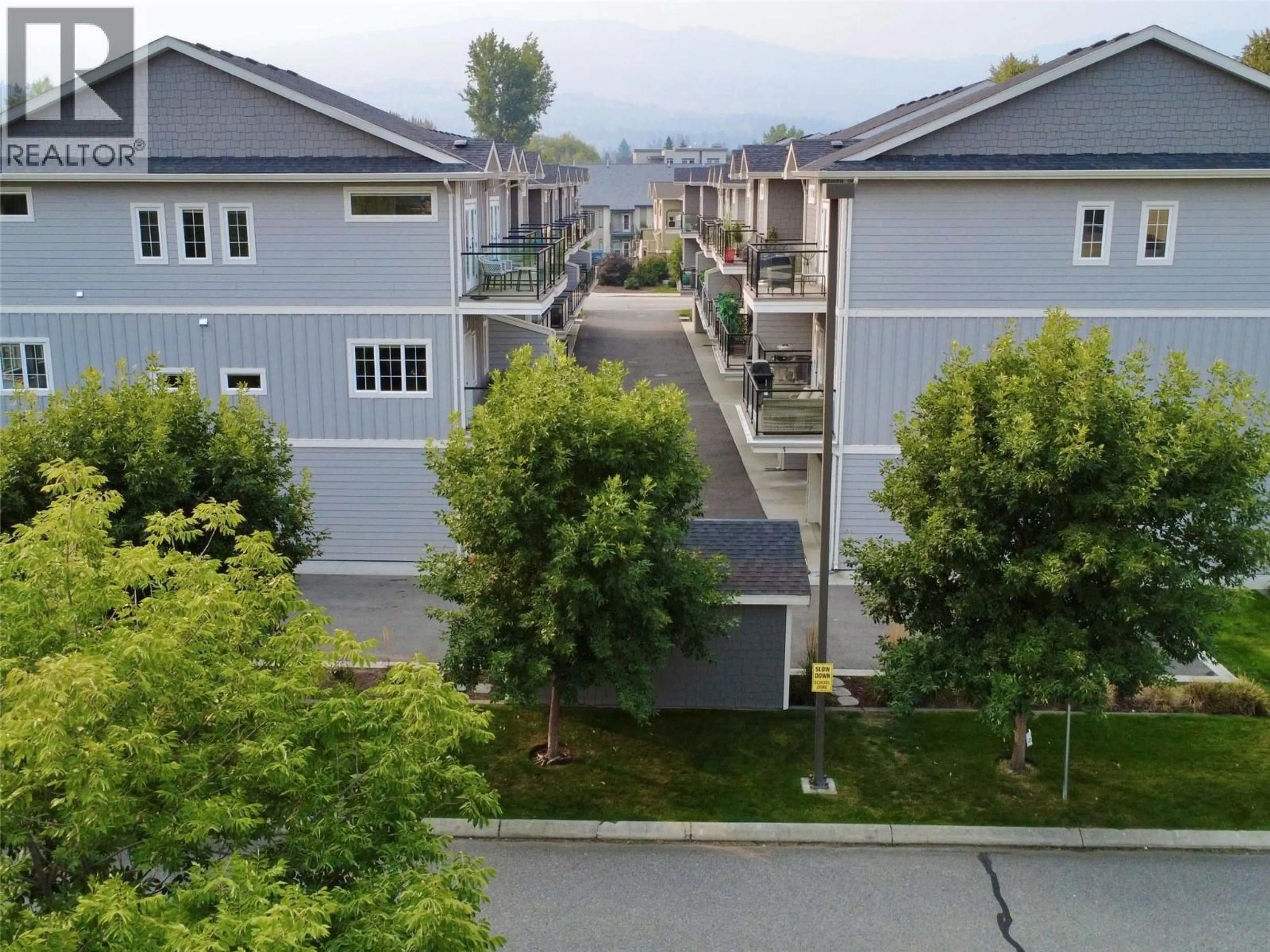 A pic from outside/outdoor area/front of a property/back of a property/a pic from drone, street for 8 - 644 LEQUIME ROAD, Kelowna British Columbia V1W1A4