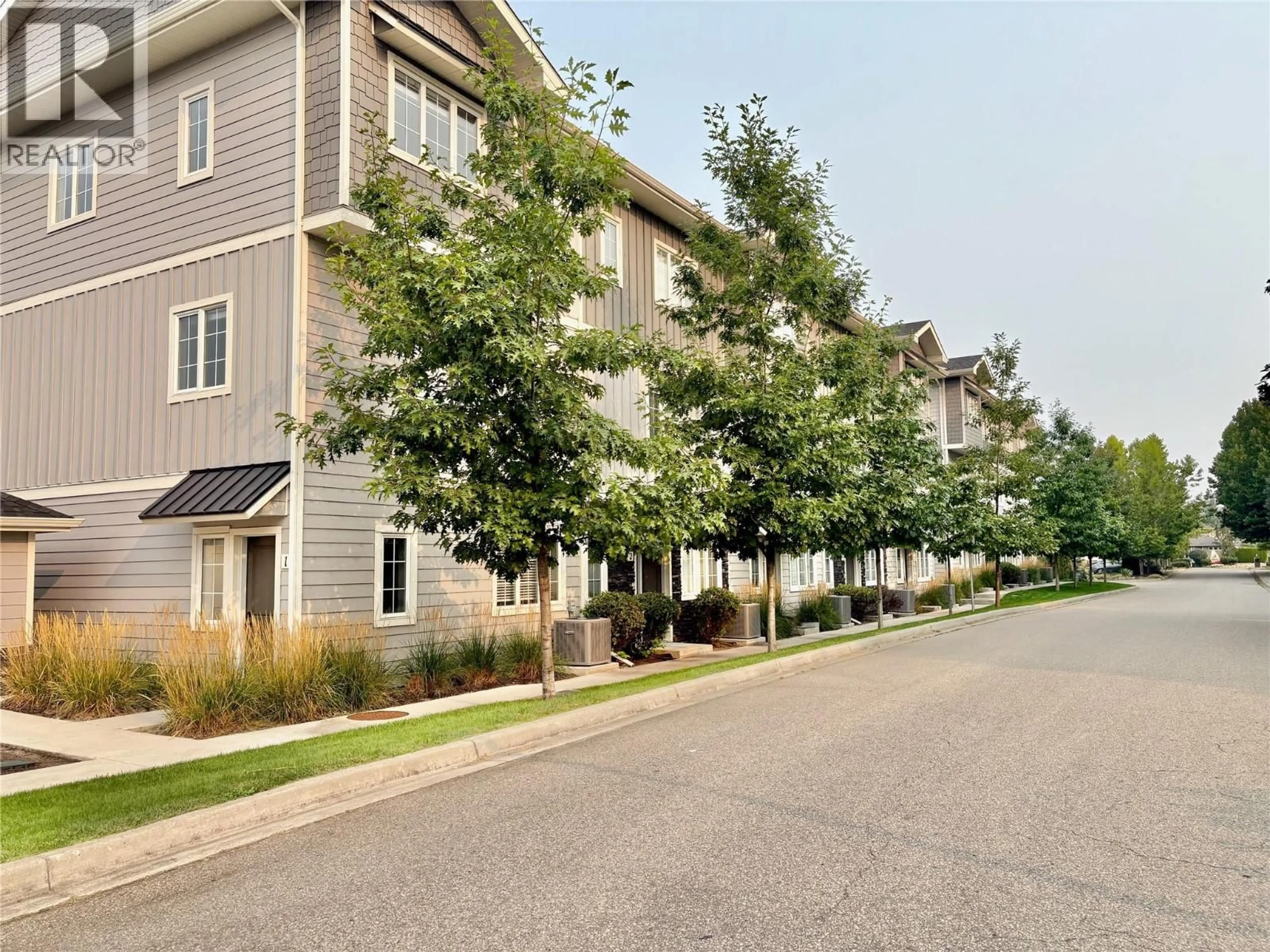 A pic from outside/outdoor area/front of a property/back of a property/a pic from drone, street for 8 - 644 LEQUIME ROAD, Kelowna British Columbia V1W1A4