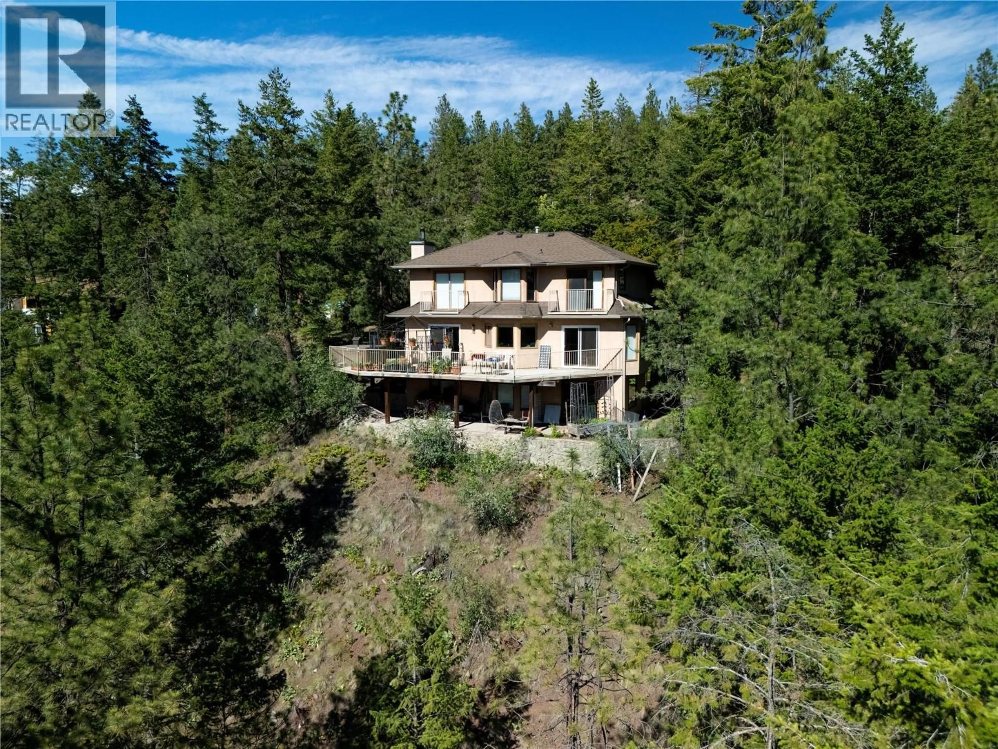 A pic from outside/outdoor area/front of a property/back of a property/a pic from drone, forest/trees view for 440 GRAINGER ROAD, Kelowna British Columbia V1V1C8