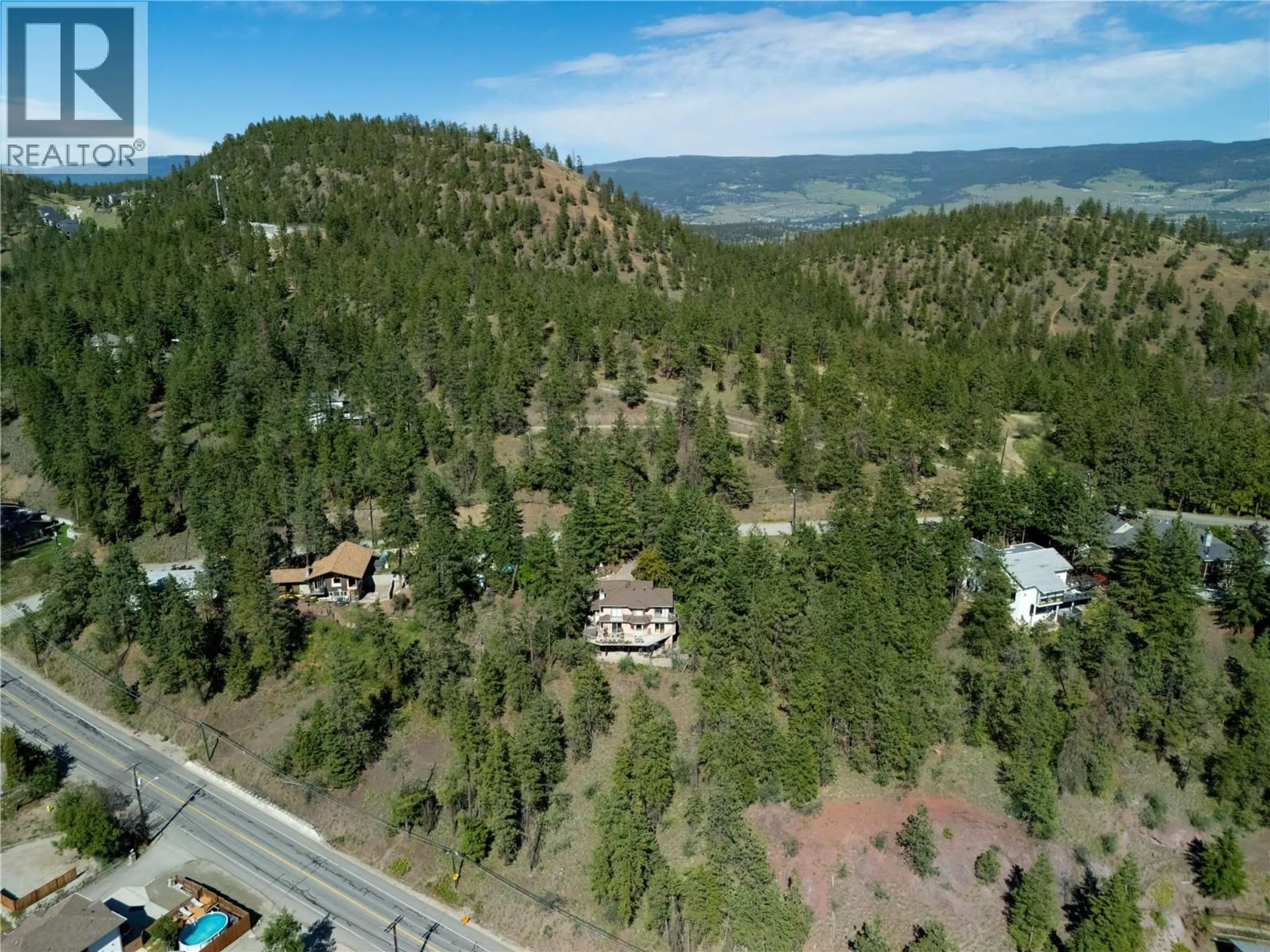 A pic from outside/outdoor area/front of a property/back of a property/a pic from drone, mountain view for 440 GRAINGER ROAD, Kelowna British Columbia V1V1C8