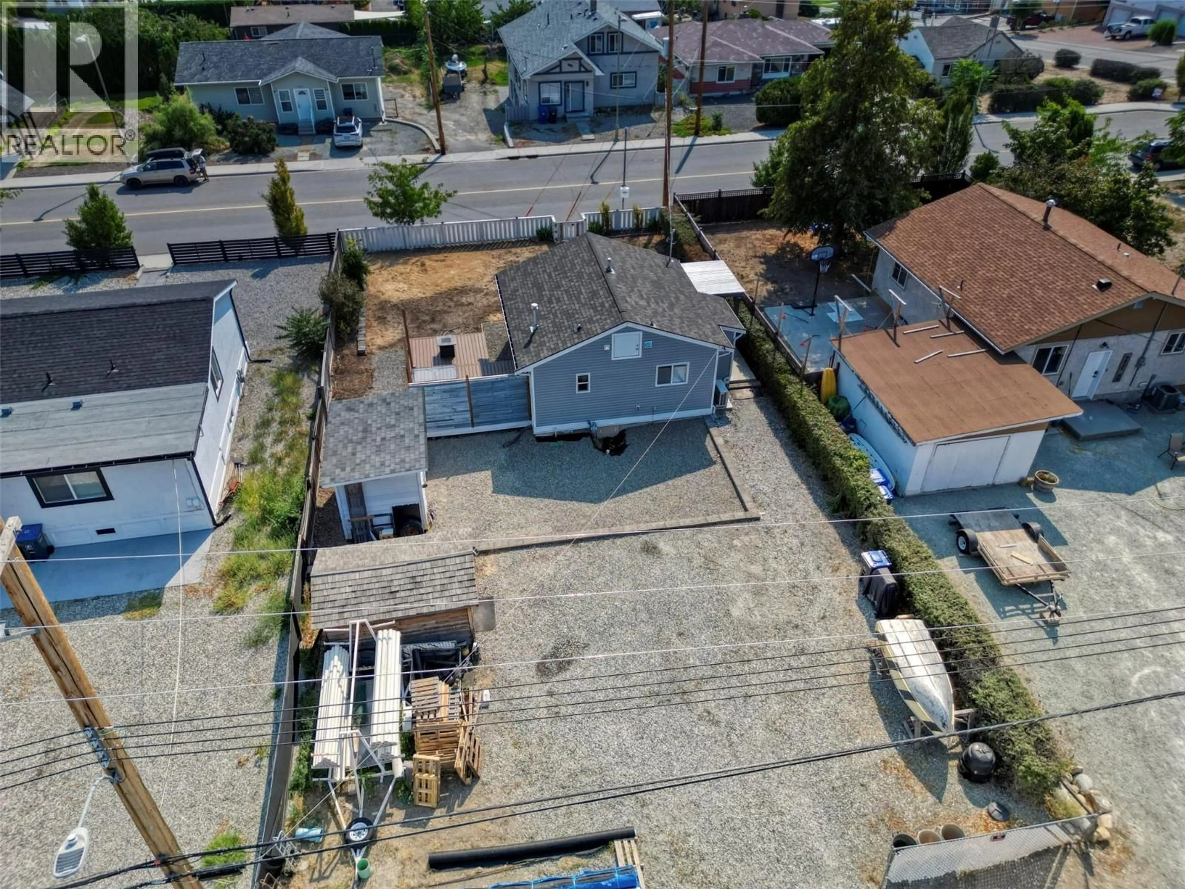 A pic from outside/outdoor area/front of a property/back of a property/a pic from drone, street for 8708 74TH AVENUE, Osoyoos British Columbia V0H1V1