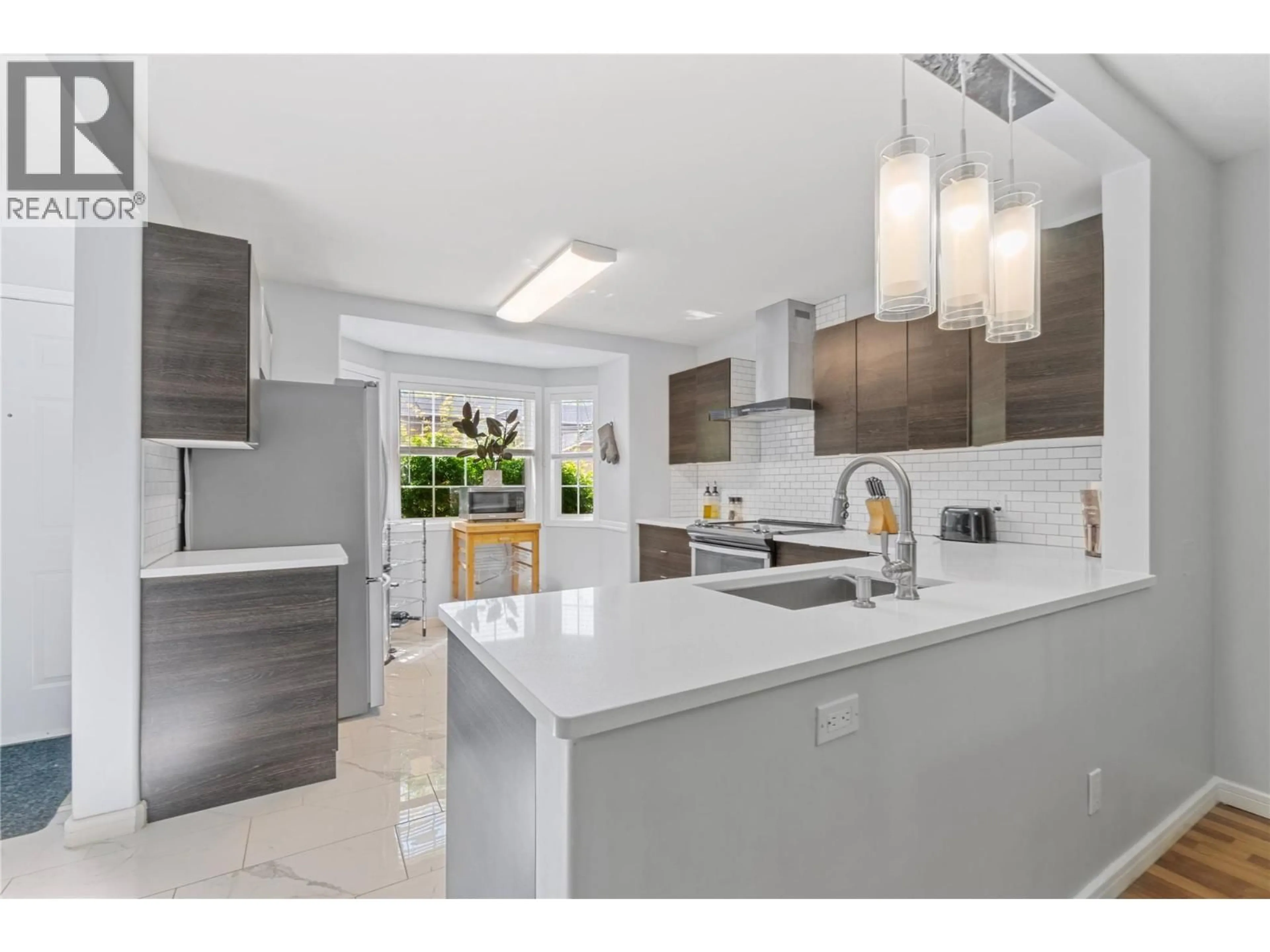 Open concept kitchen, ceramic/tile floor for 25 - 535 GLENMEADOWS ROAD, Kelowna British Columbia V1V1X7