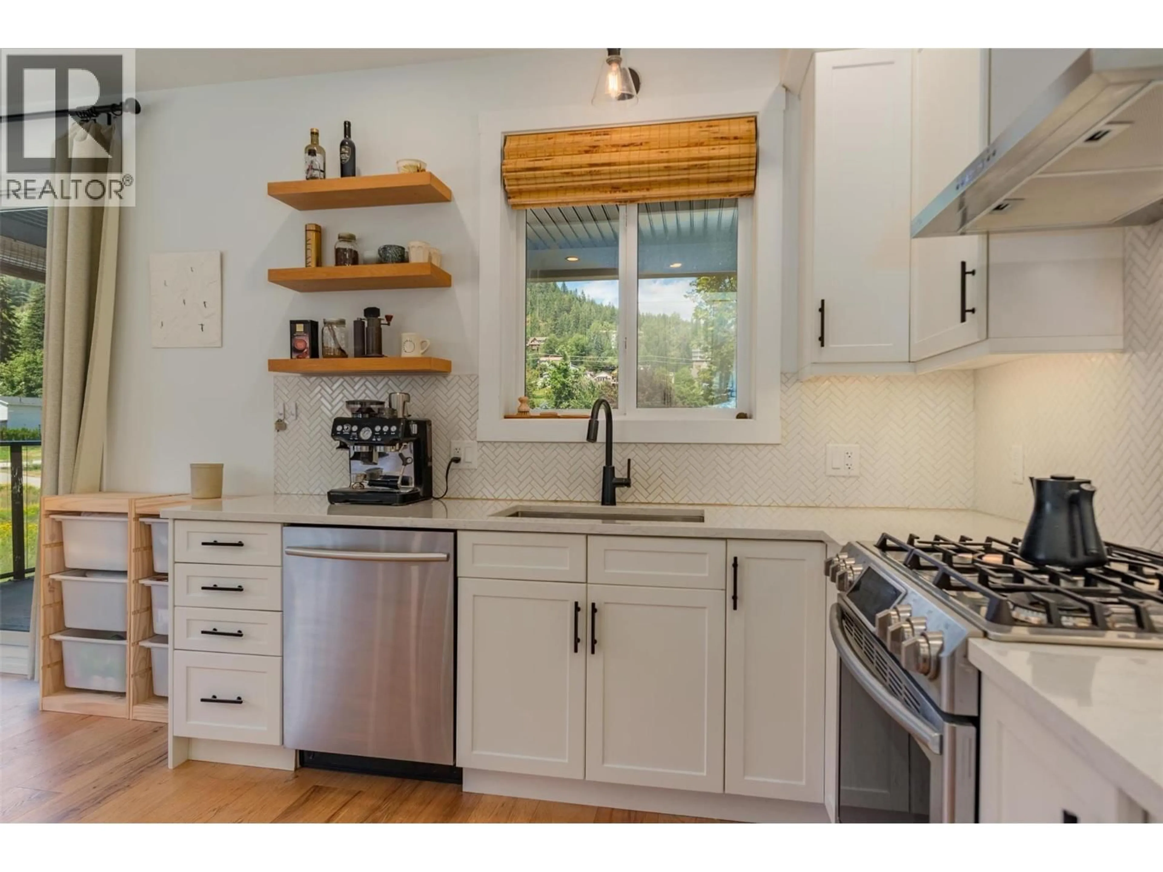 Open concept kitchen, wood/laminate floor for A - 1606 THOMPSON AVENUE, Rossland British Columbia V0G1Y0