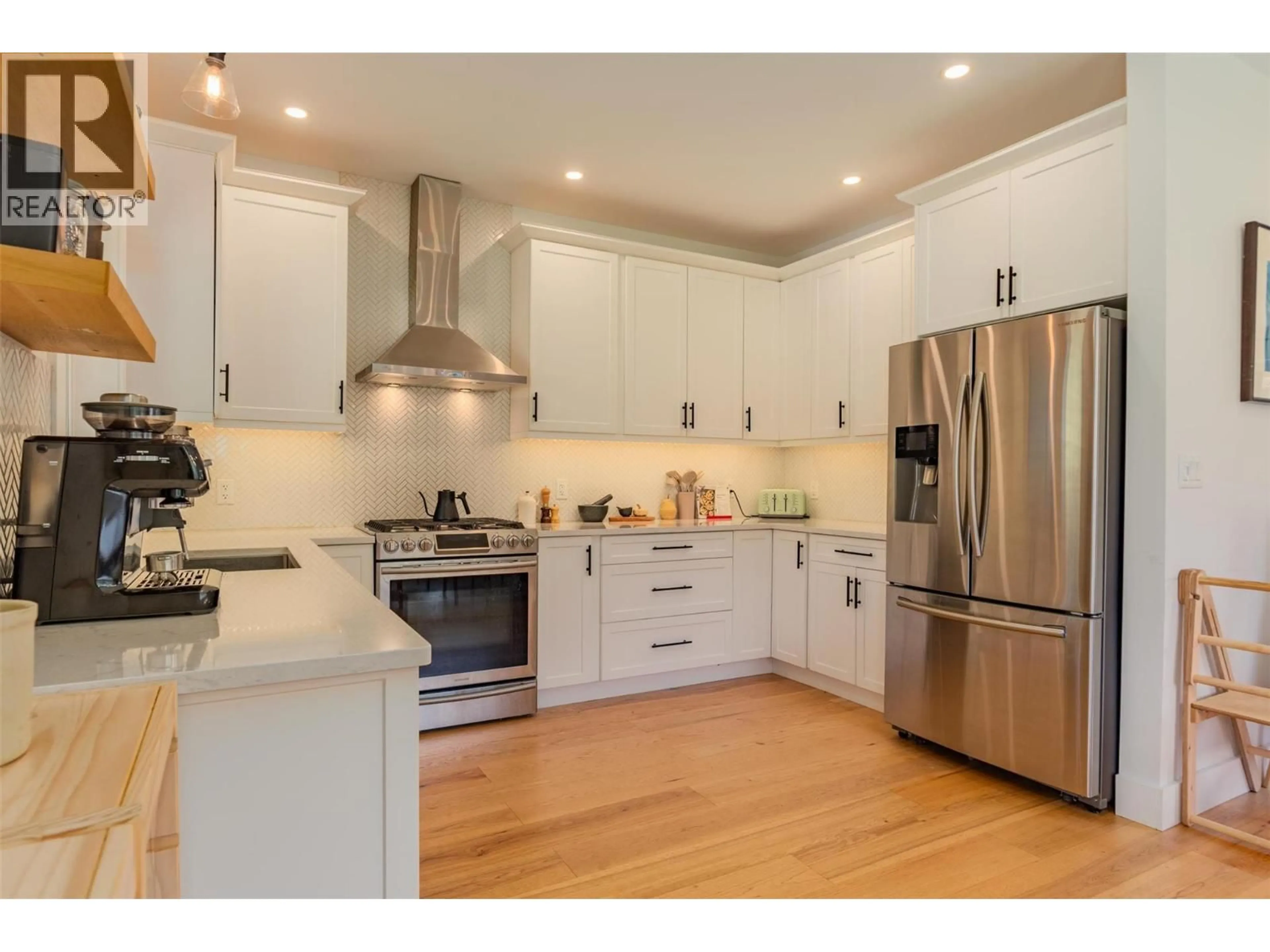 Open concept kitchen, wood/laminate floor for A - 1606 THOMPSON AVENUE, Rossland British Columbia V0G1Y0