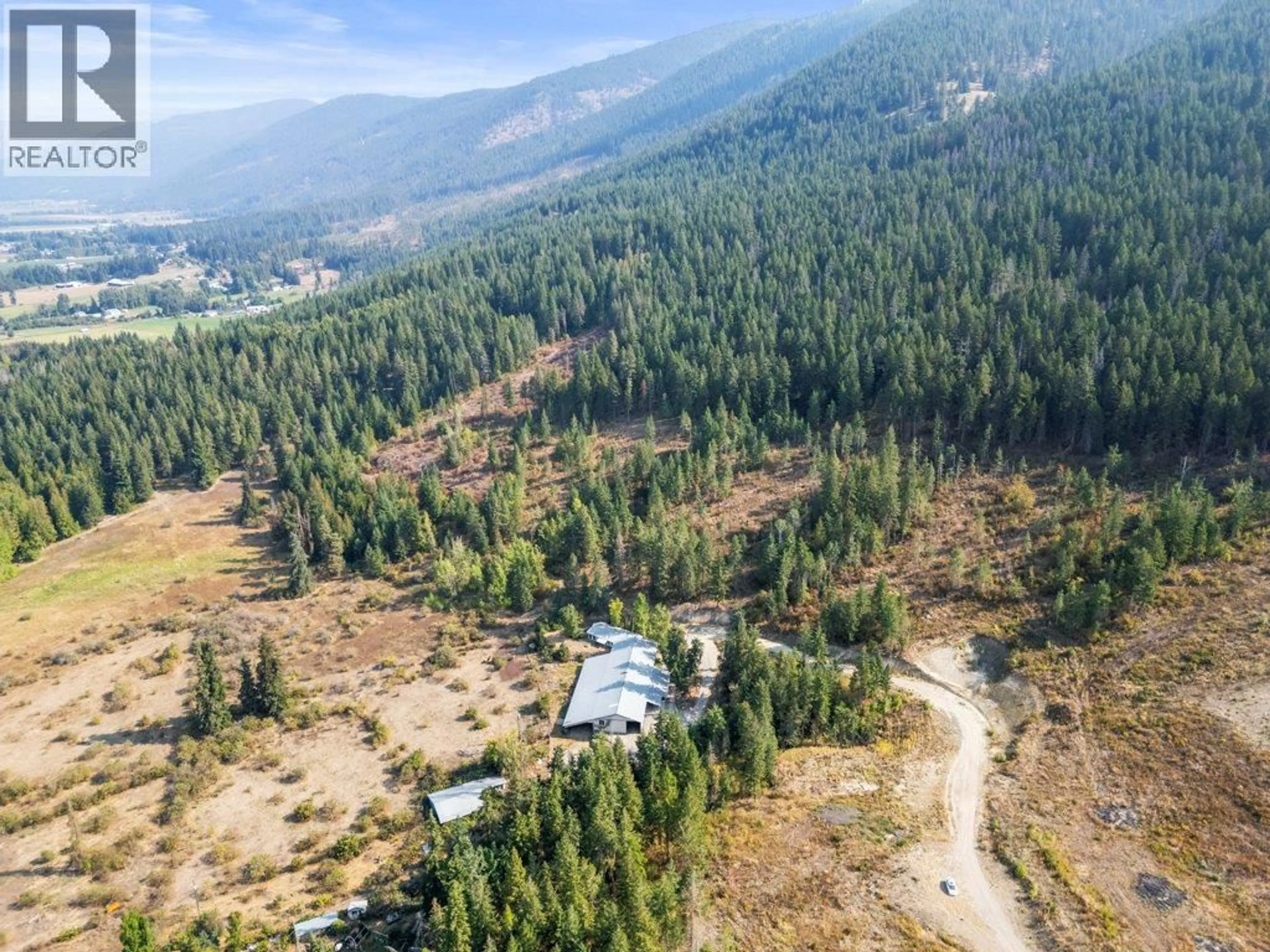 A pic from outside/outdoor area/front of a property/back of a property/a pic from drone, mountain view for 3298 UPPER MCLEOD ROAD, Armstrong British Columbia V0E1B8
